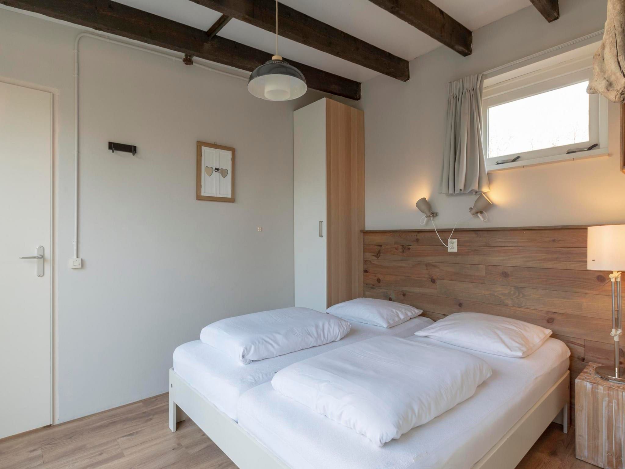 Een slaapkamer van Duinland 245 in Sint Maartenszee