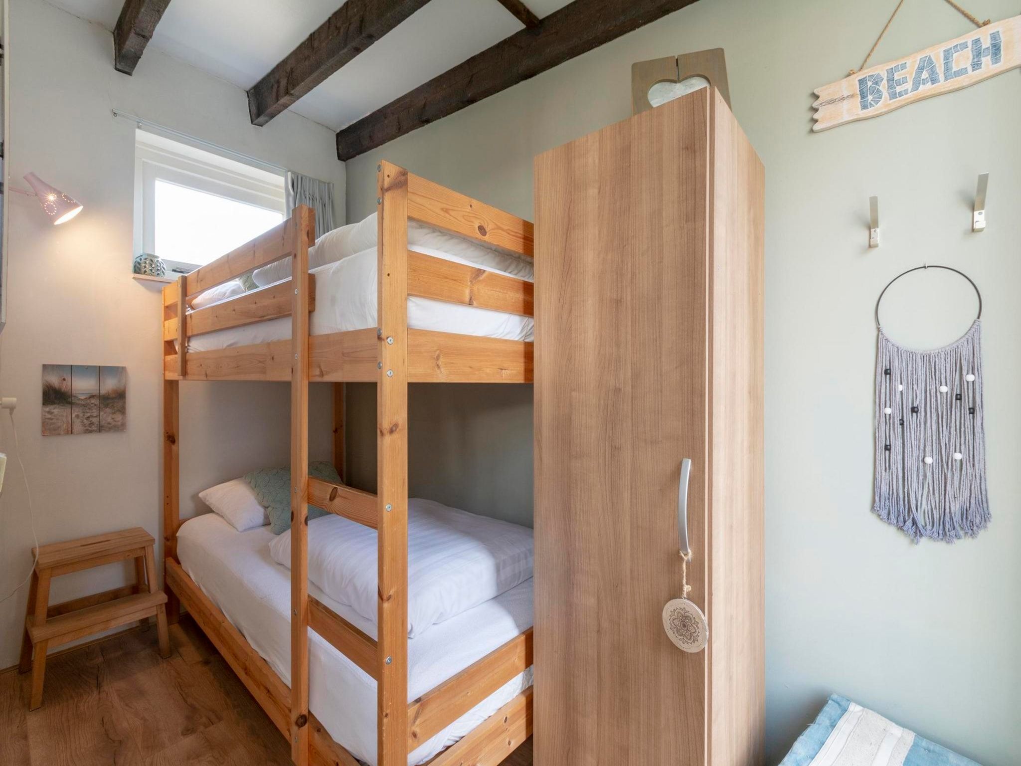 Een slaapkamer van Duinland 245 in Sint Maartenszee