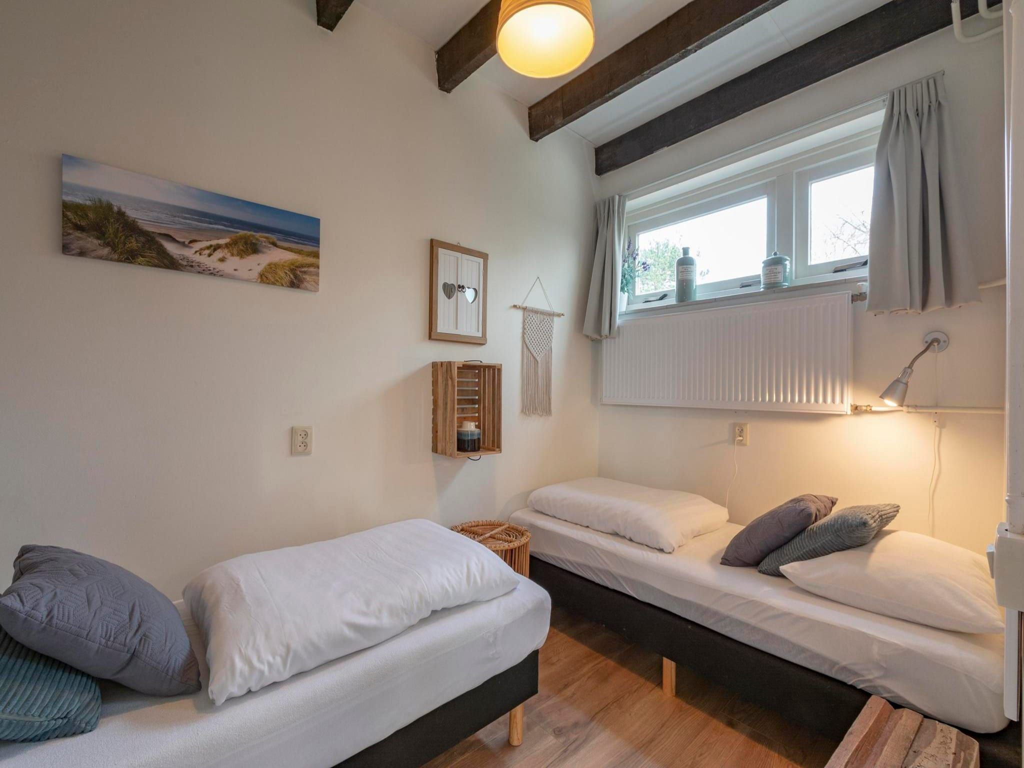 Een slaapkamer van Duinland 245 in Sint Maartenszee