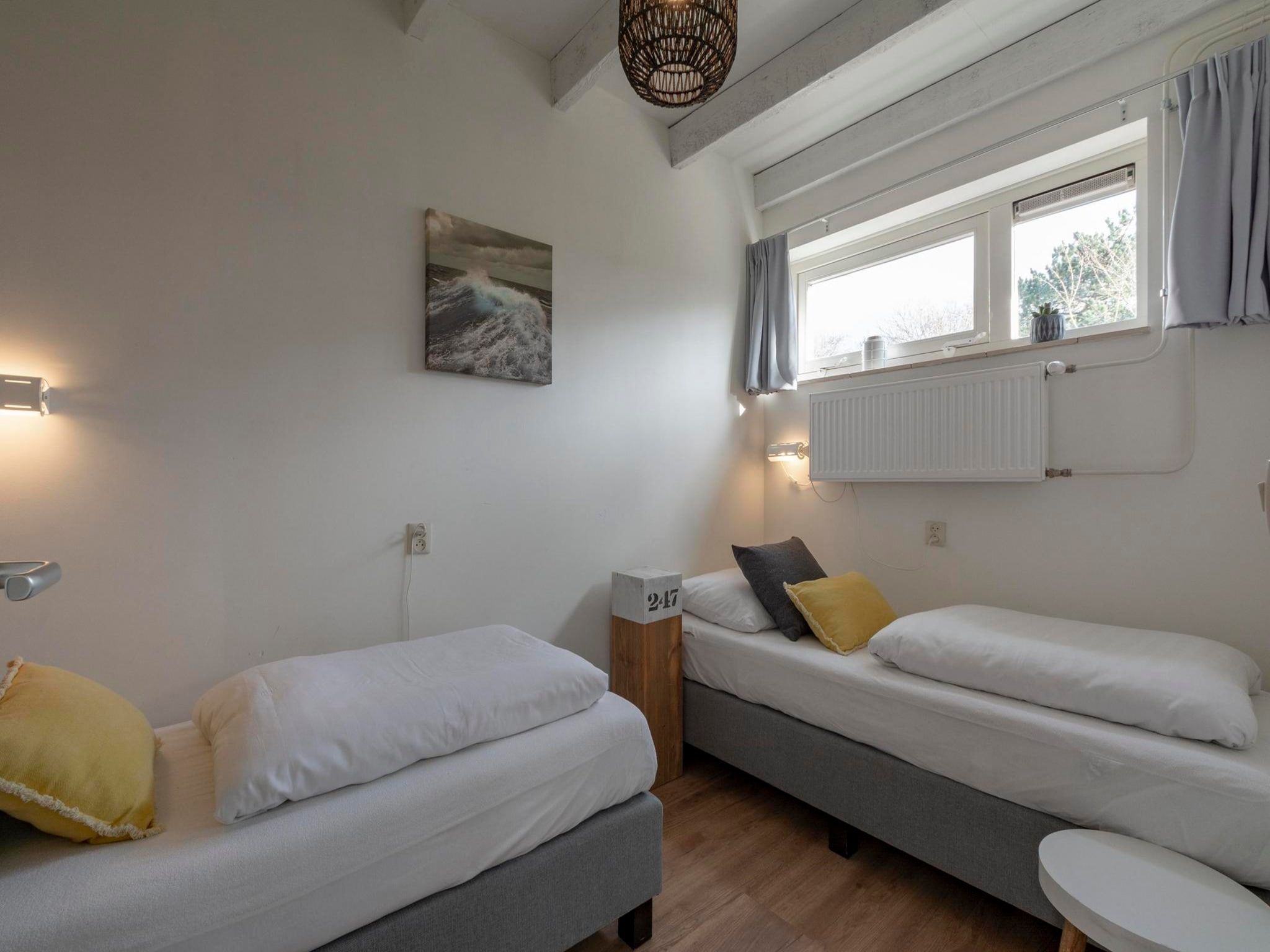 Een slaapkamer van Duinland 247 in Sint Maartenszee