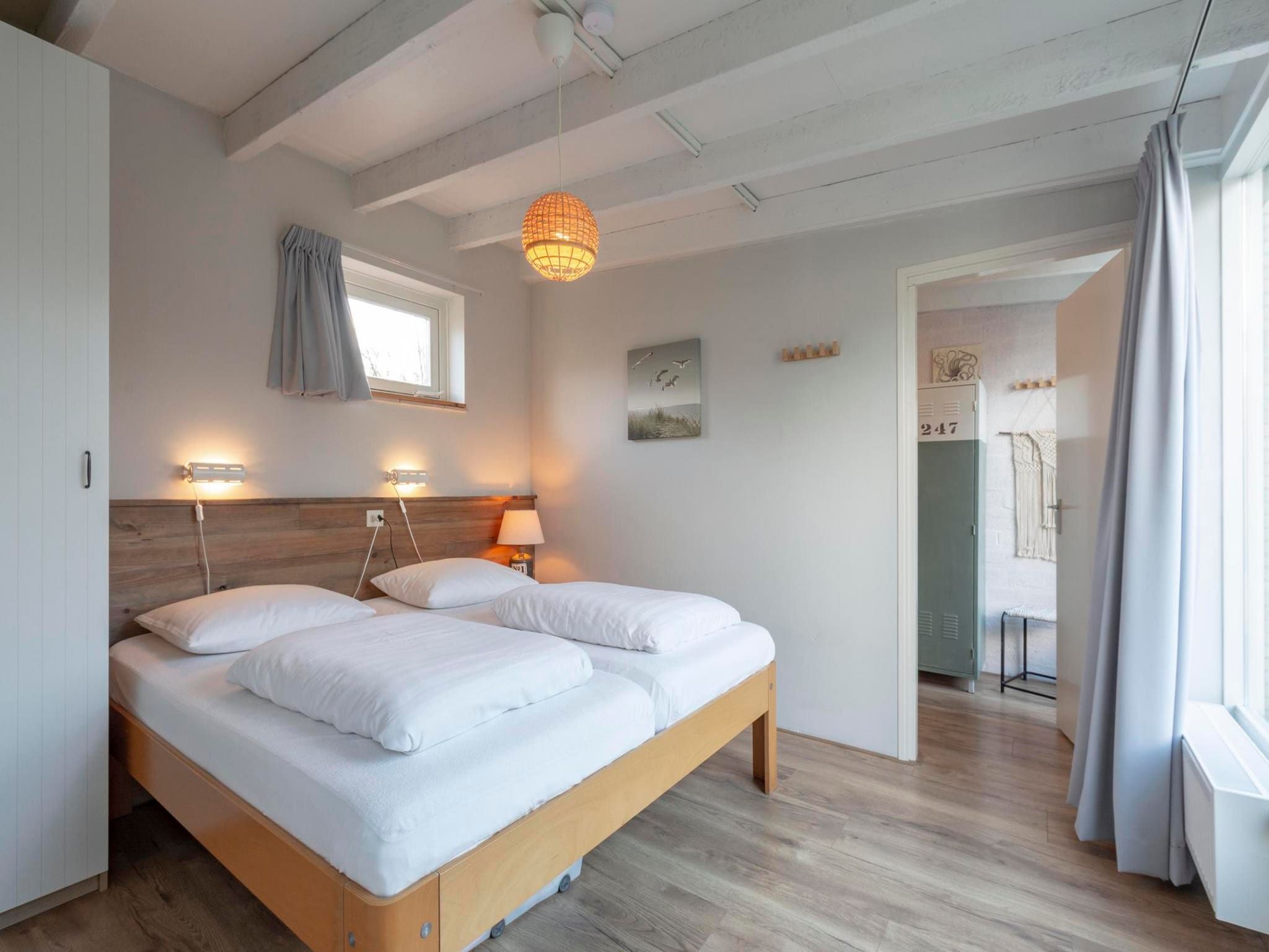 Een slaapkamer van Duinland 247 in Sint Maartenszee