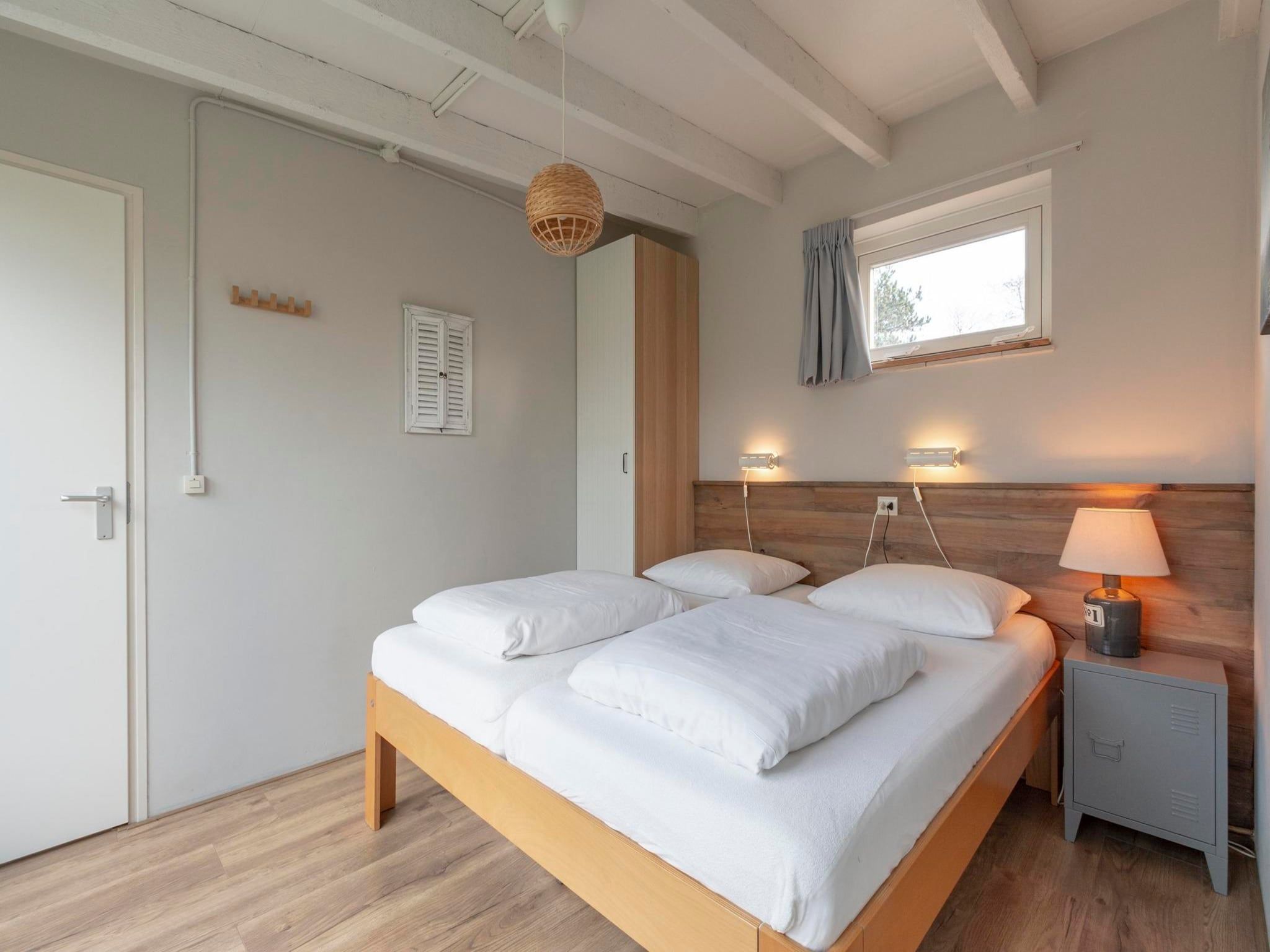 Een slaapkamer van Duinland 247 in Sint Maartenszee