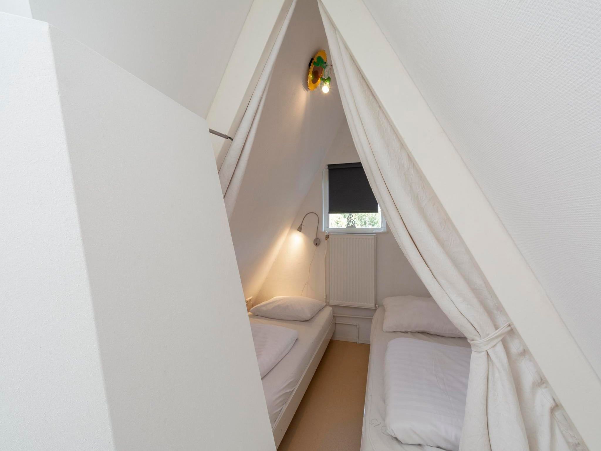 Een slaapkamer van Duinland 46 in Sint Maartenszee