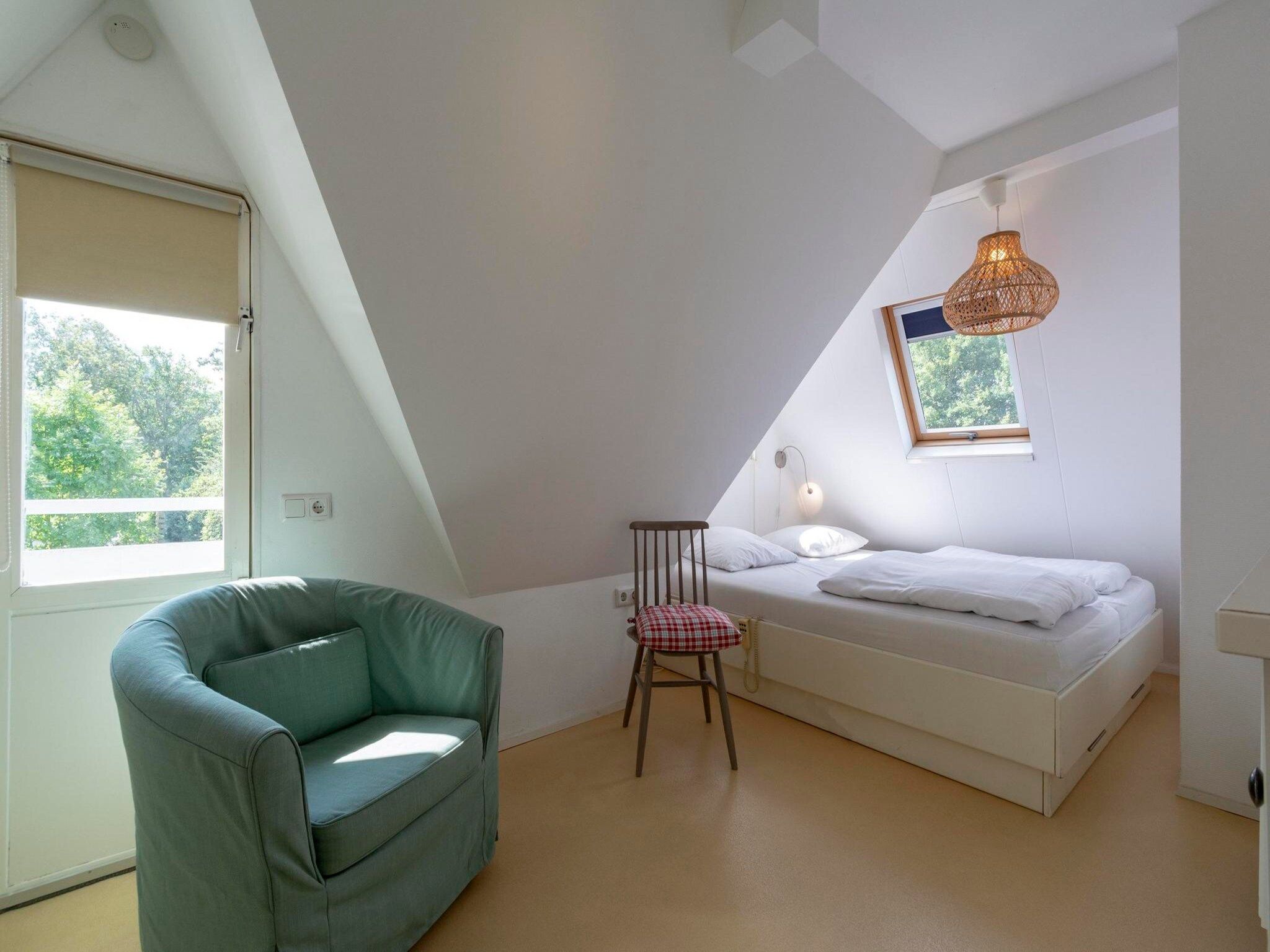 Een slaapkamer van Duinland 46 in Sint Maartenszee