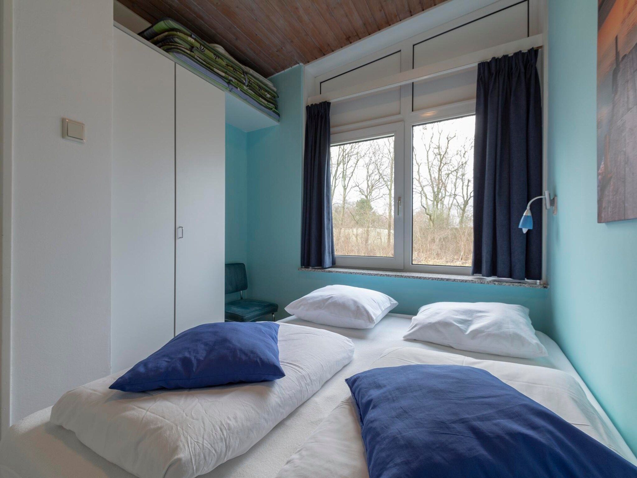 Een slaapkamer van Duinland 89 in Sint Maartenszee