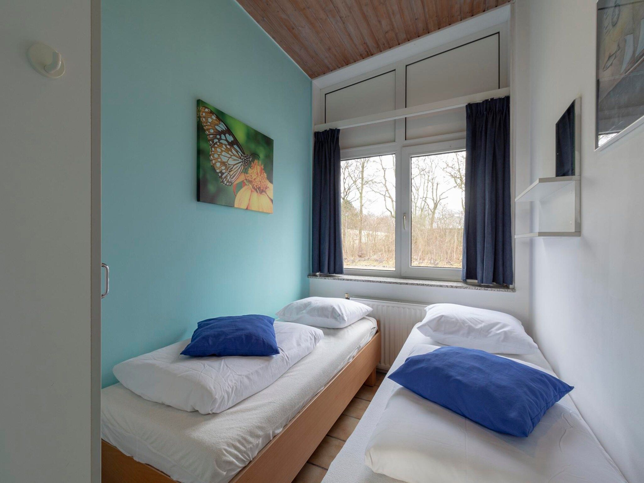 Een slaapkamer van Duinland 89 in Sint Maartenszee
