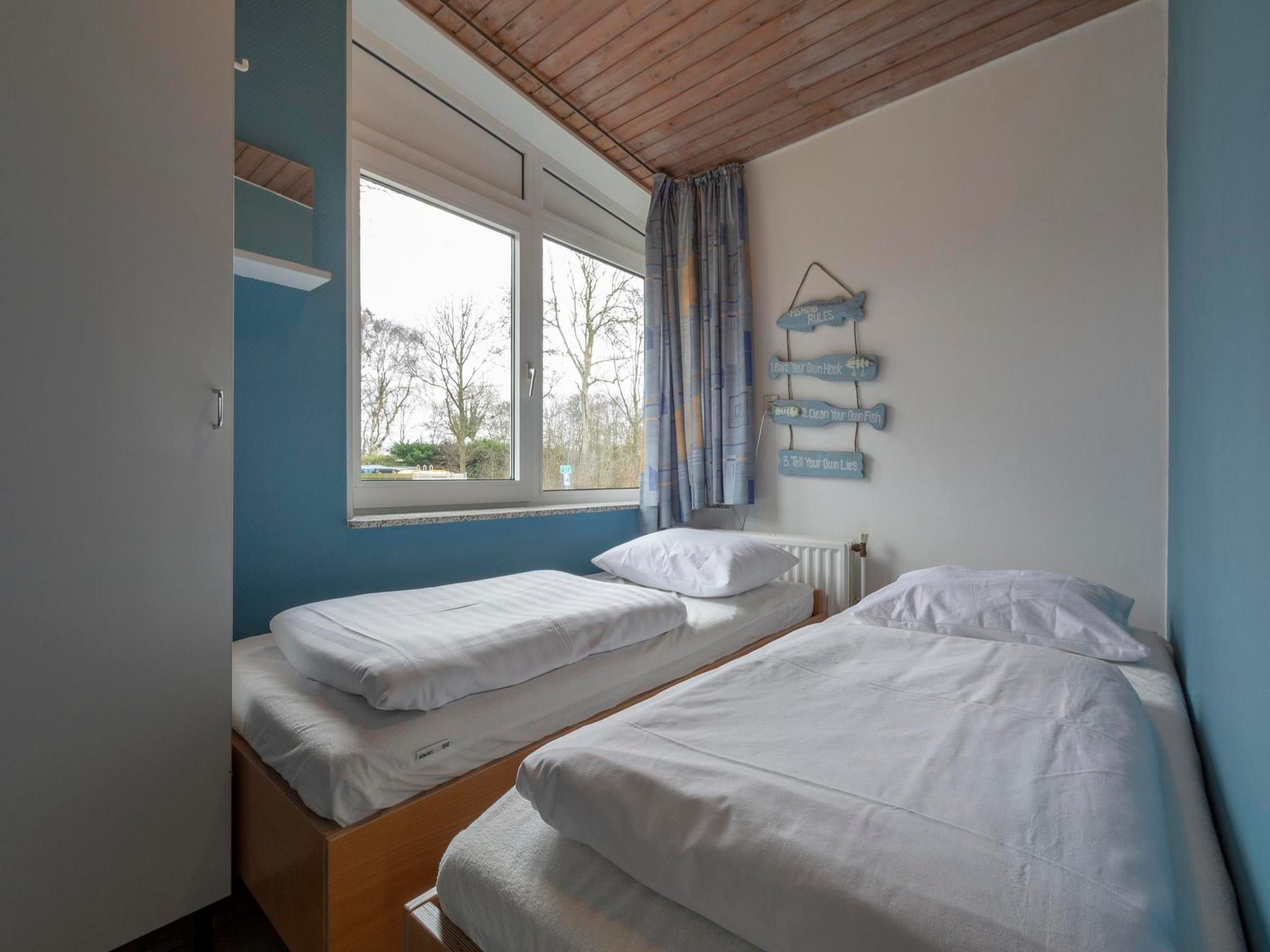 Een slaapkamer van Duinland 90 in Sint Maartenszee