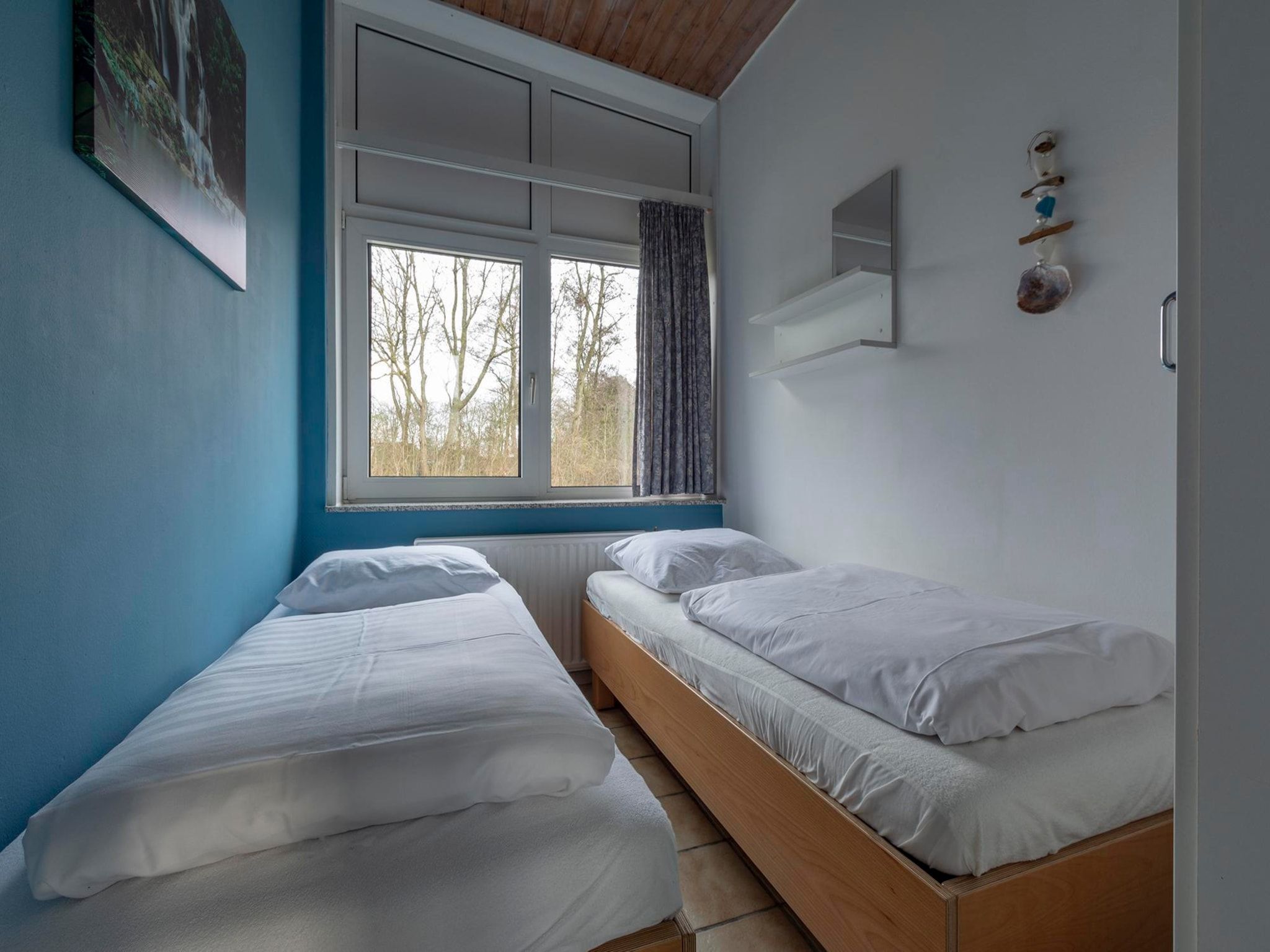 Een slaapkamer van Duinland 90 in Sint Maartenszee