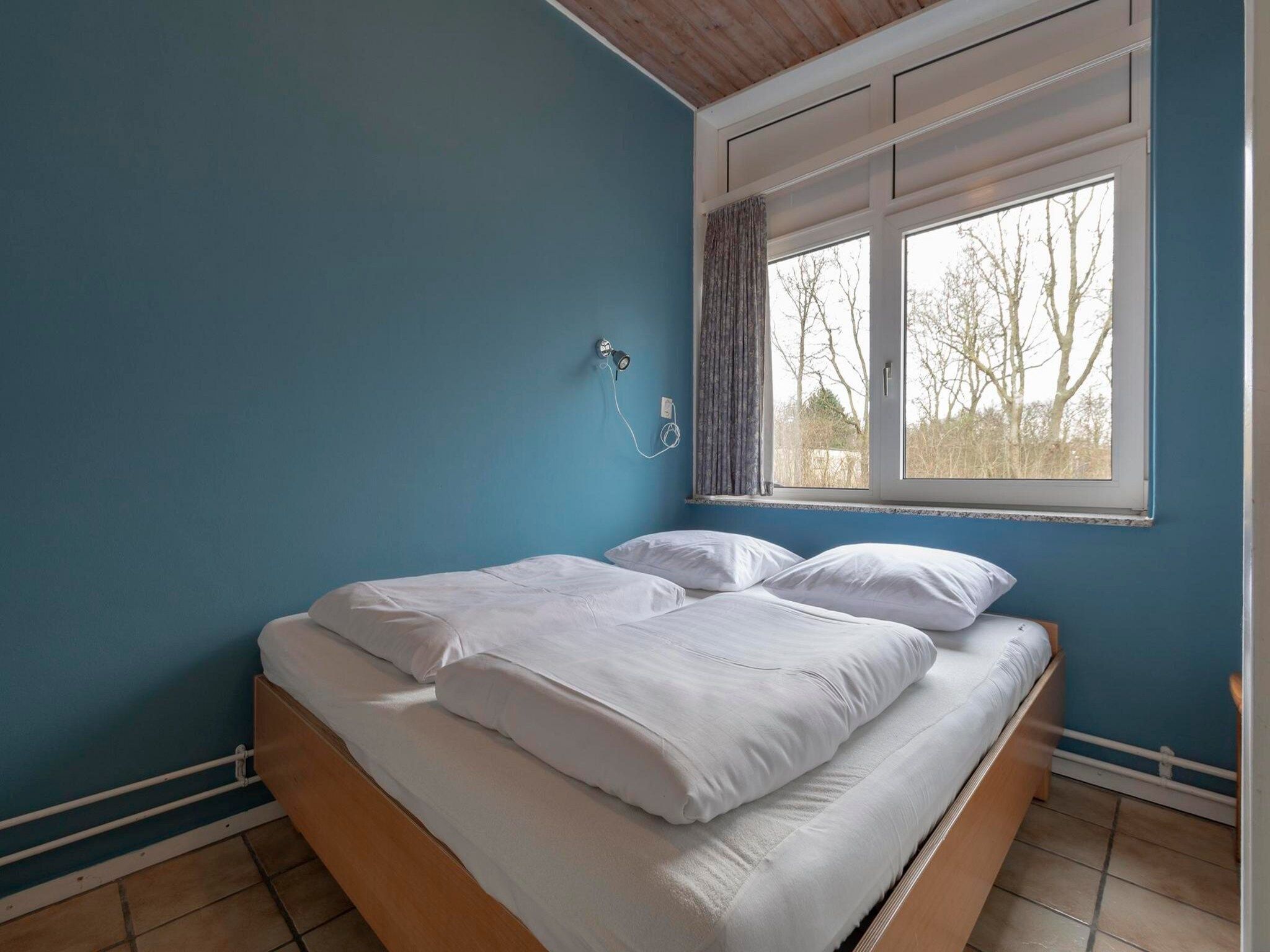 Een slaapkamer van Duinland 90 in Sint Maartenszee