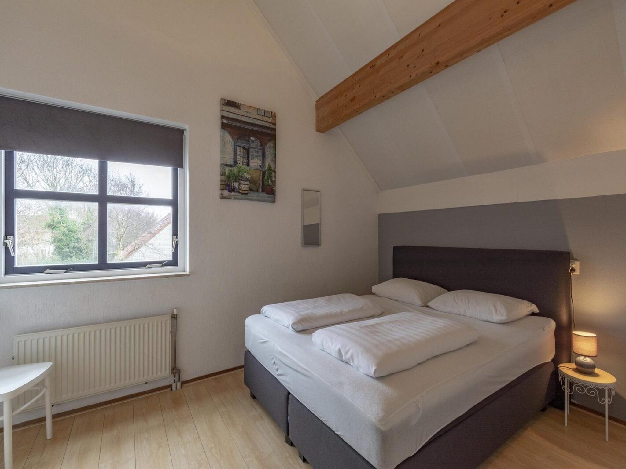 Een slaapkamer van Ooghduyne 75 in Julianadorp aan Zee