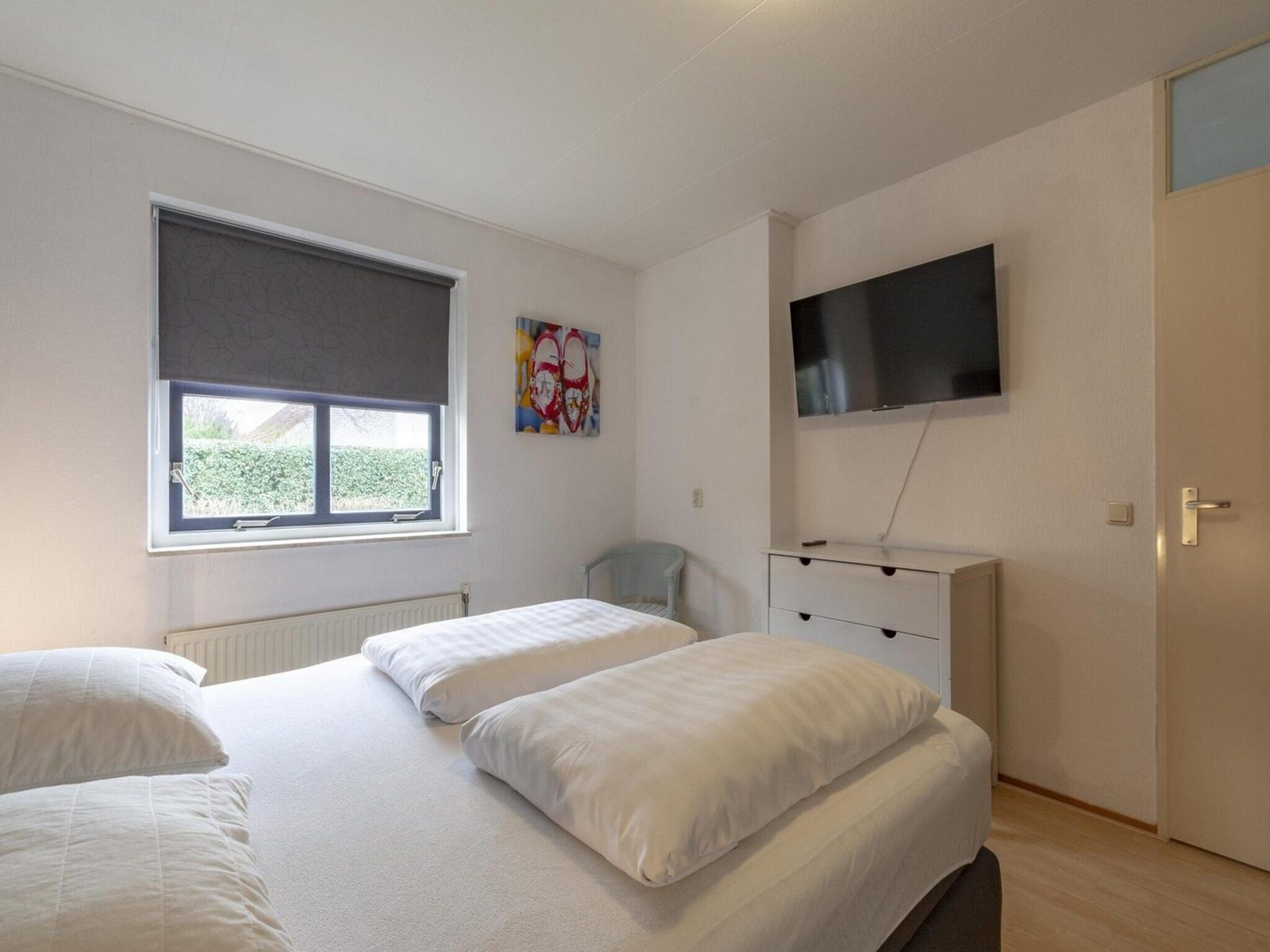 Een slaapkamer van Ooghduyne 75 in Julianadorp aan Zee