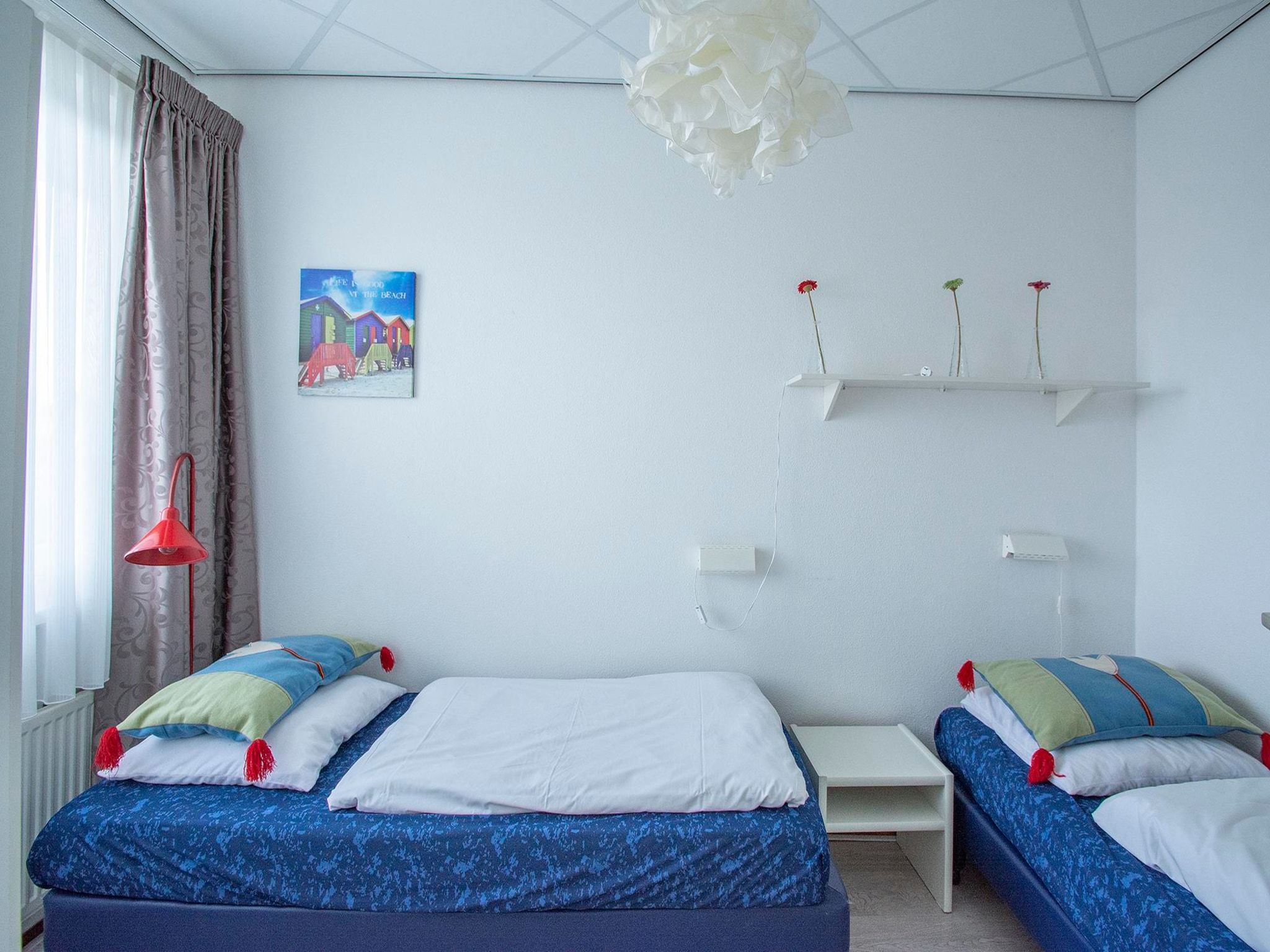 Een slaapkamer van Strandslag 107 in Julianadorp aan Zee