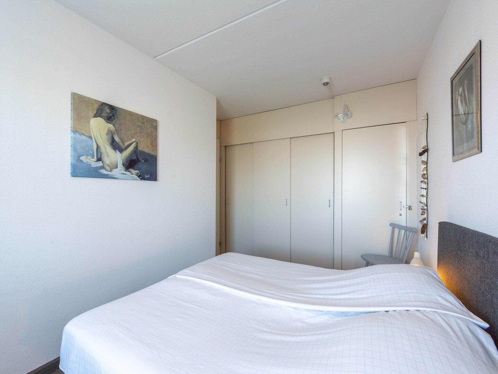 Een slaapkamer van Strandslag 157 in Julianadorp aan Zee