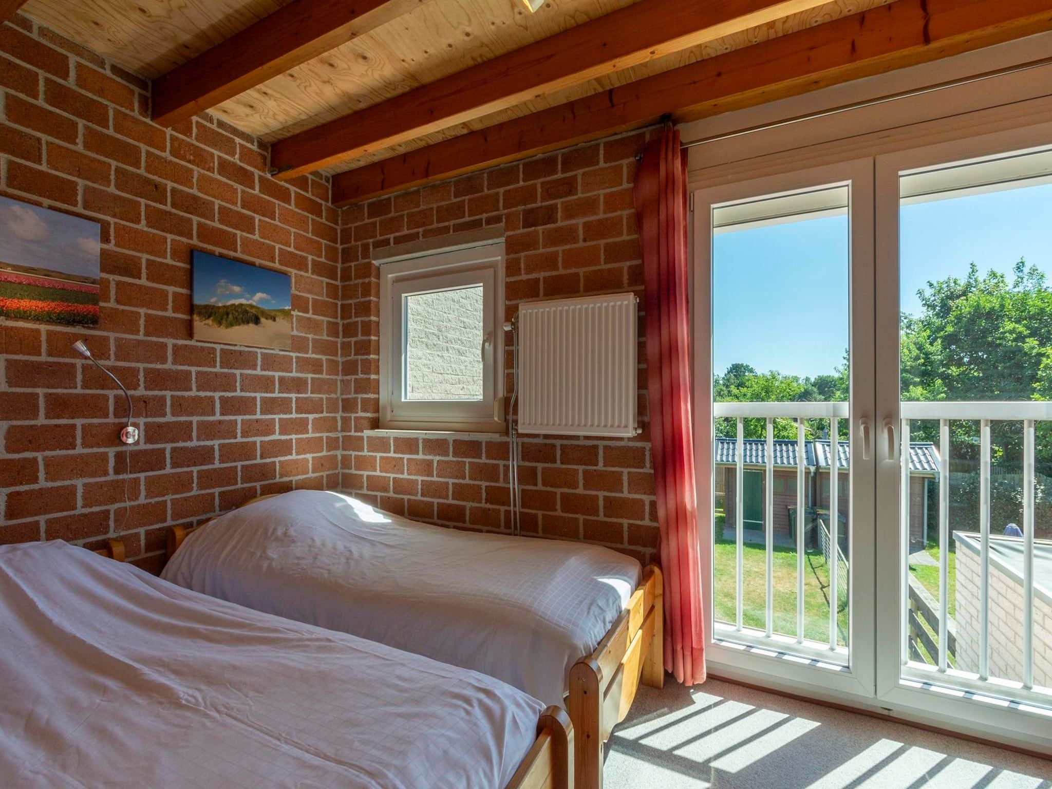 Een slaapkamer van Abbestederweg 24A in Callantsoog