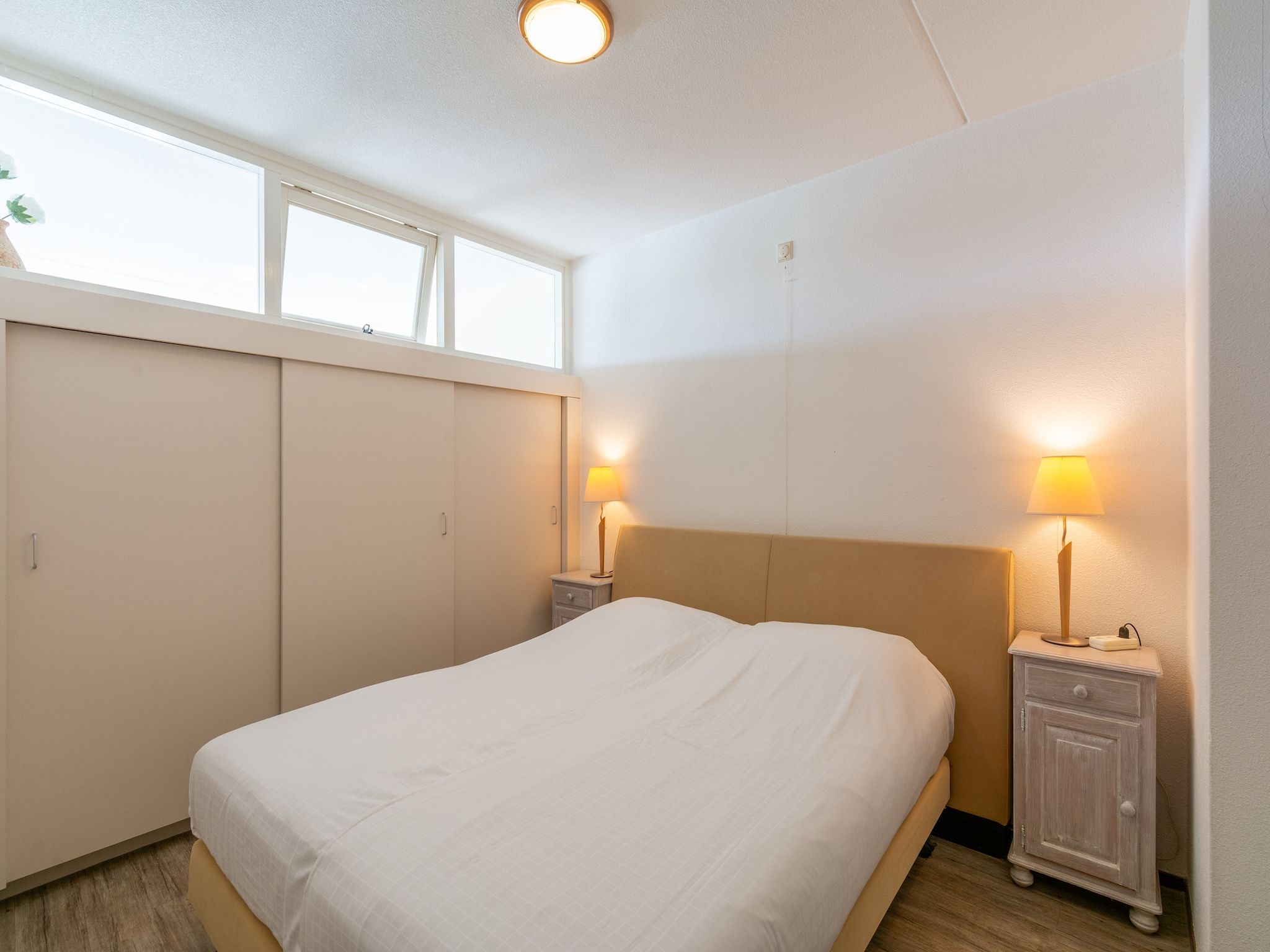 Een slaapkamer van Strandslag 189 in Julianadorp aan Zee