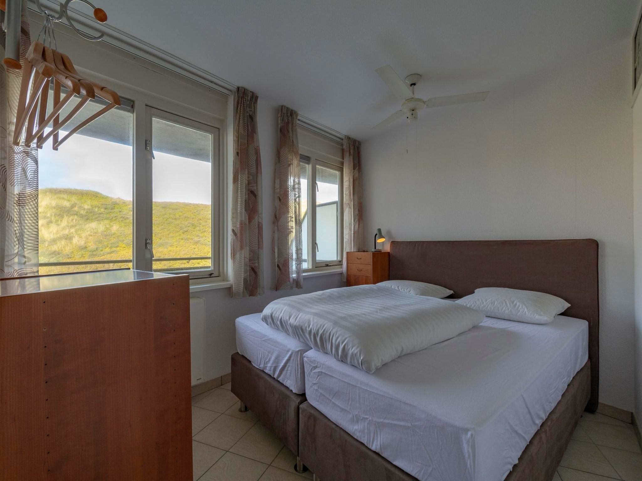 Een slaapkamer van Wijde Blick 208 in Callantsoog