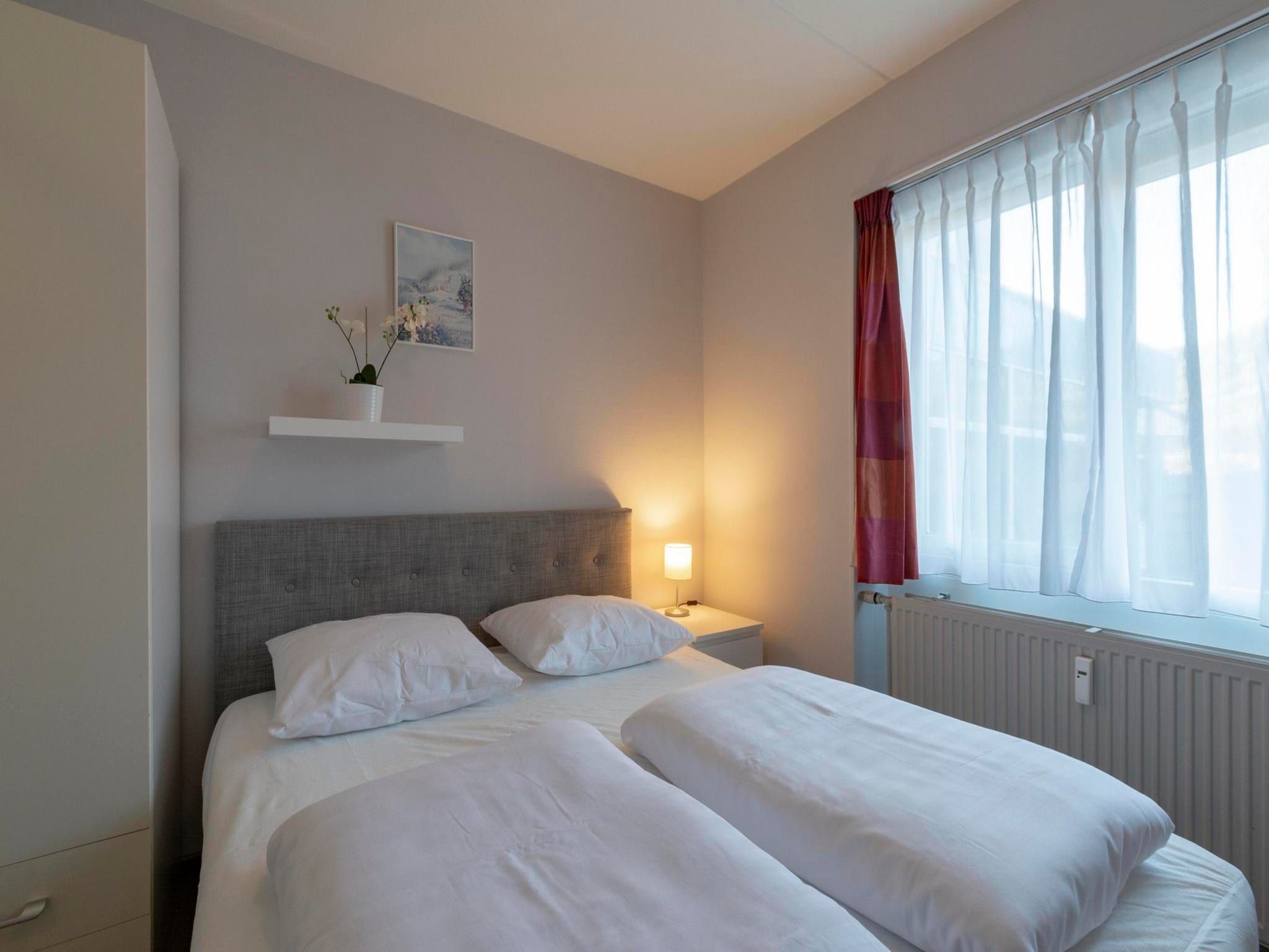 Een slaapkamer van Beach Appartement 08 in Callantsoog