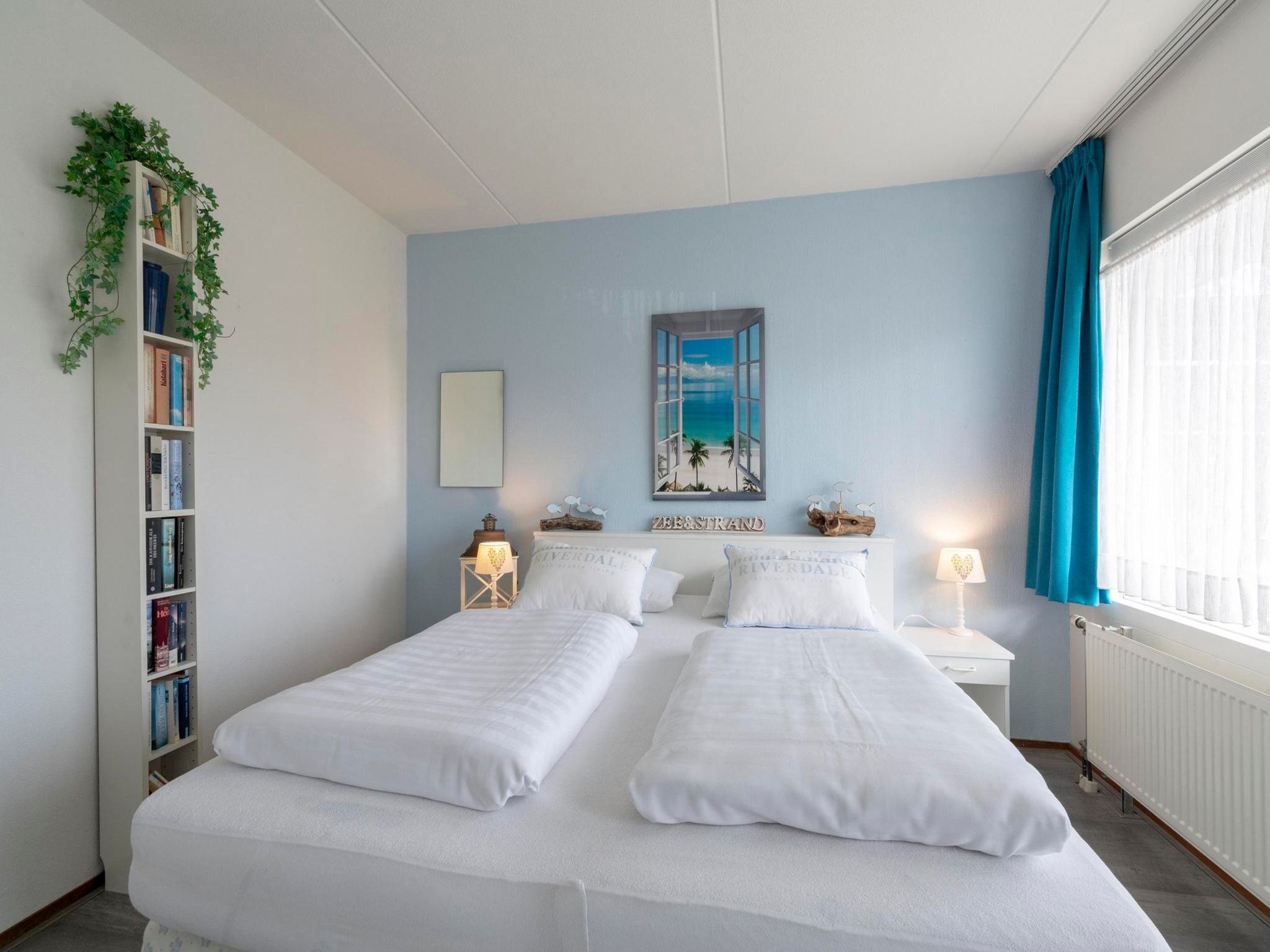 Een slaapkamer van Beach Appartement 11 in Callantsoog