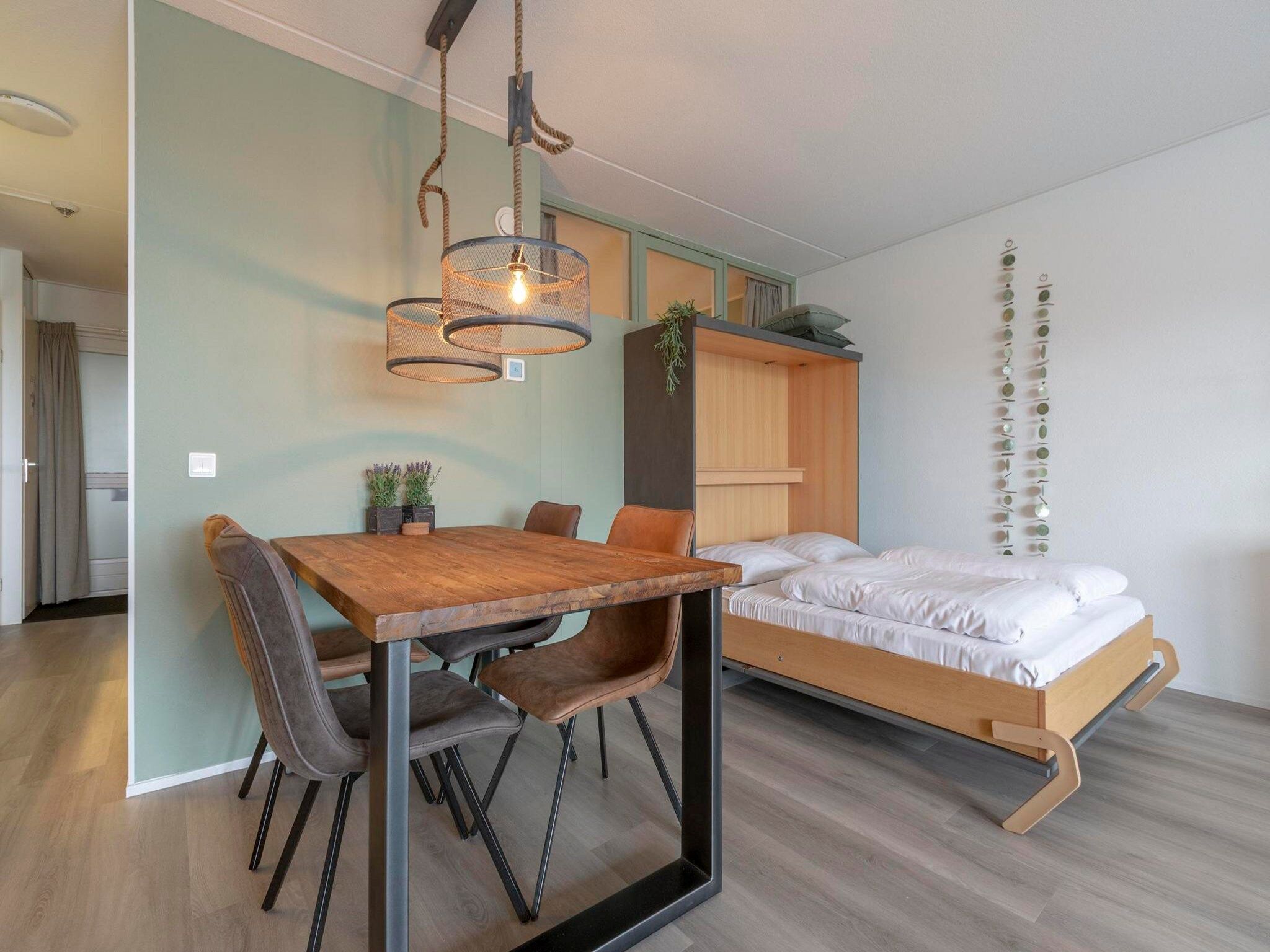 Een slaapkamer van Strandslag 203 in Julianadorp aan Zee