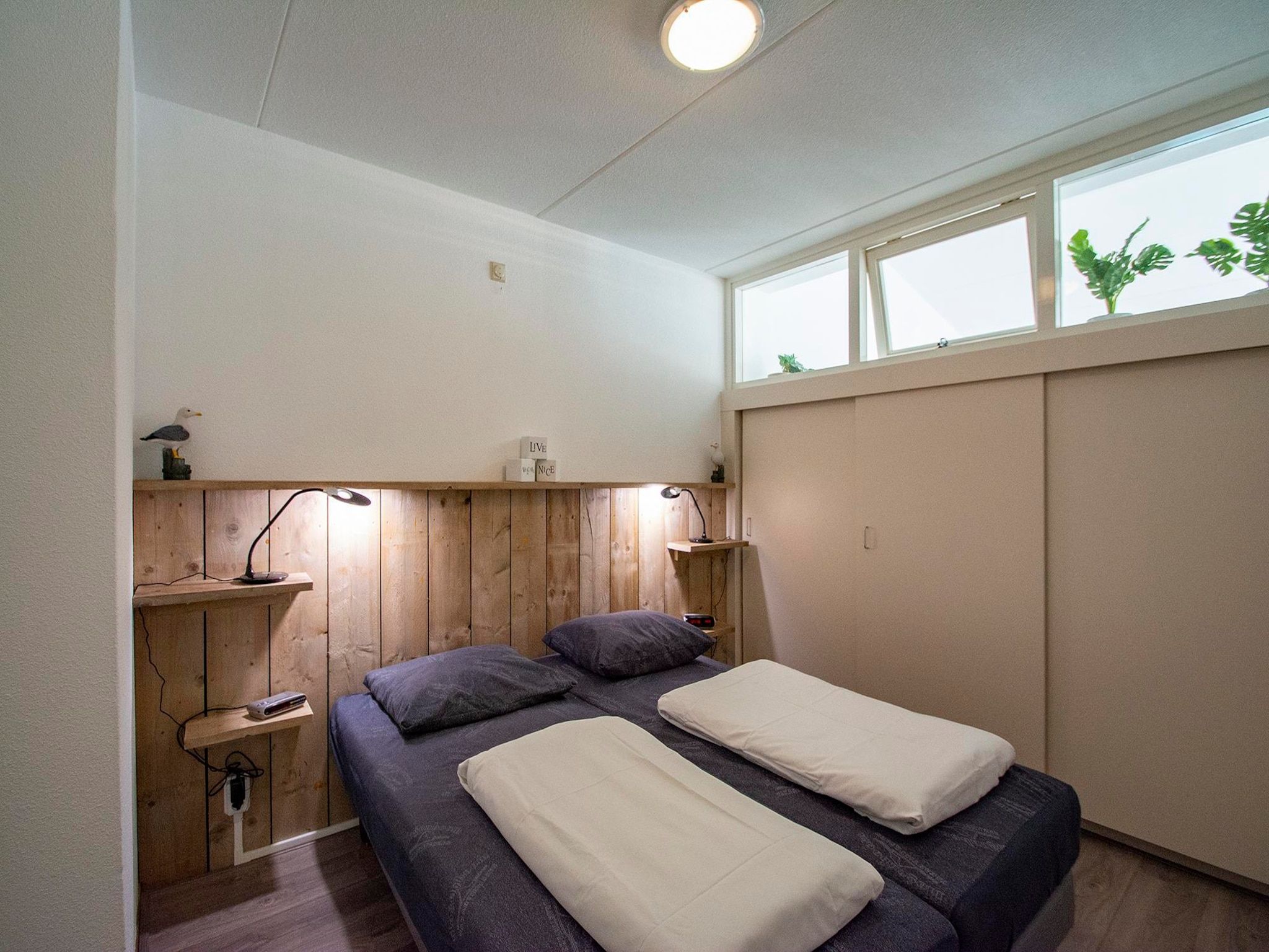 Een slaapkamer van Strandslag 215 in Julianadorp aan Zee