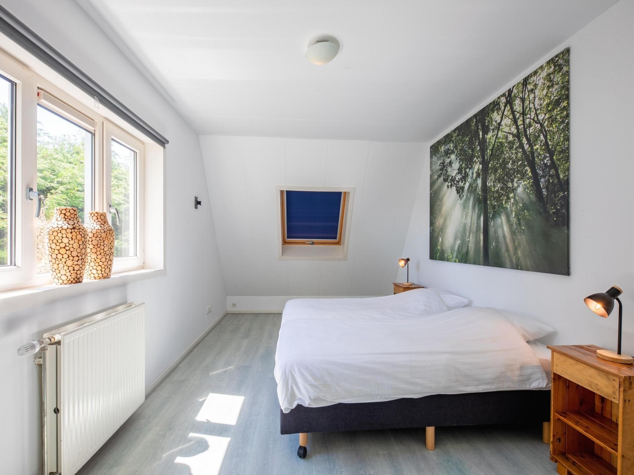 Een slaapkamer van Strandhuys Oester in De Koog