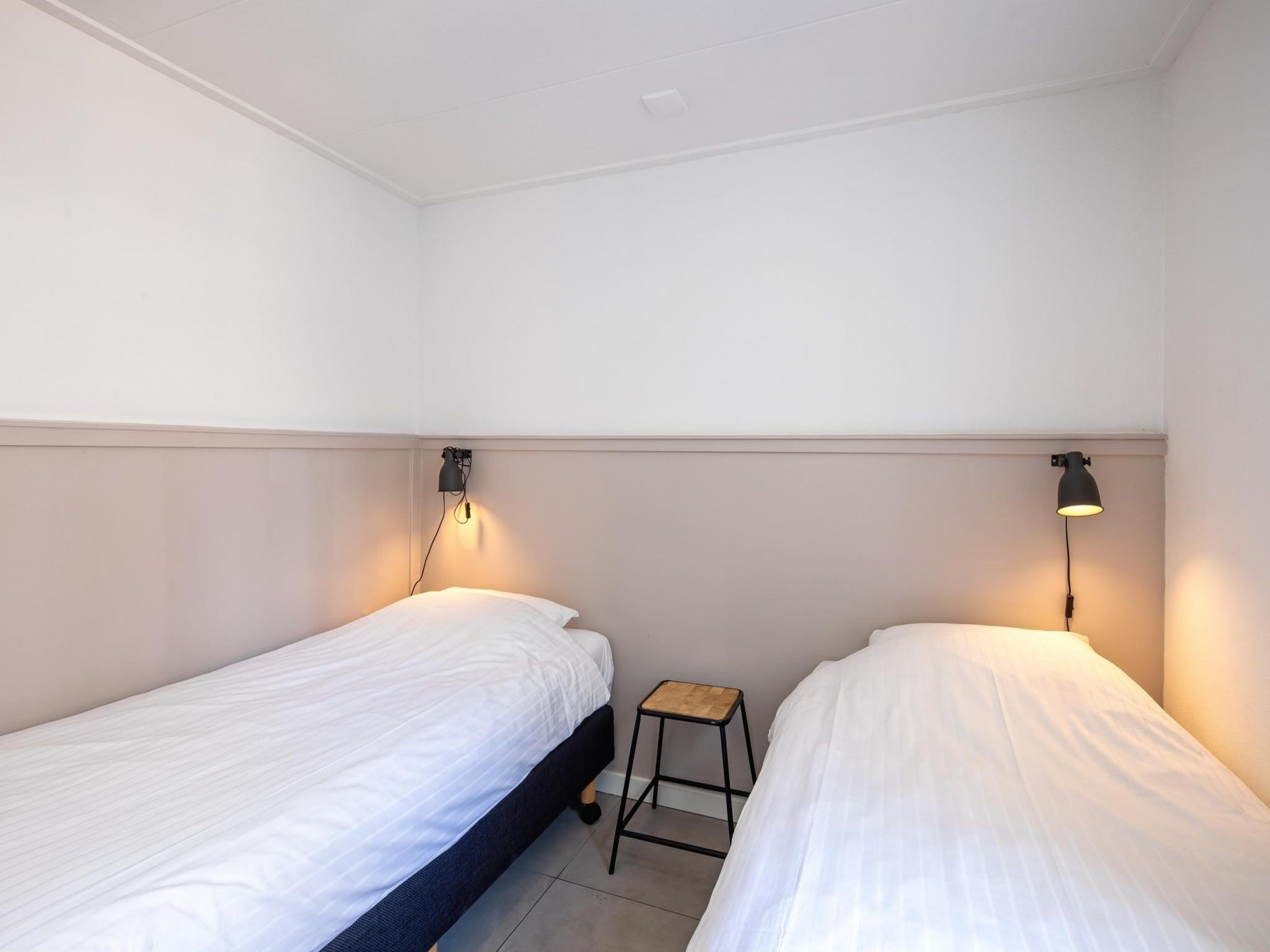 Een slaapkamer van Strandhuys Oester in De Koog