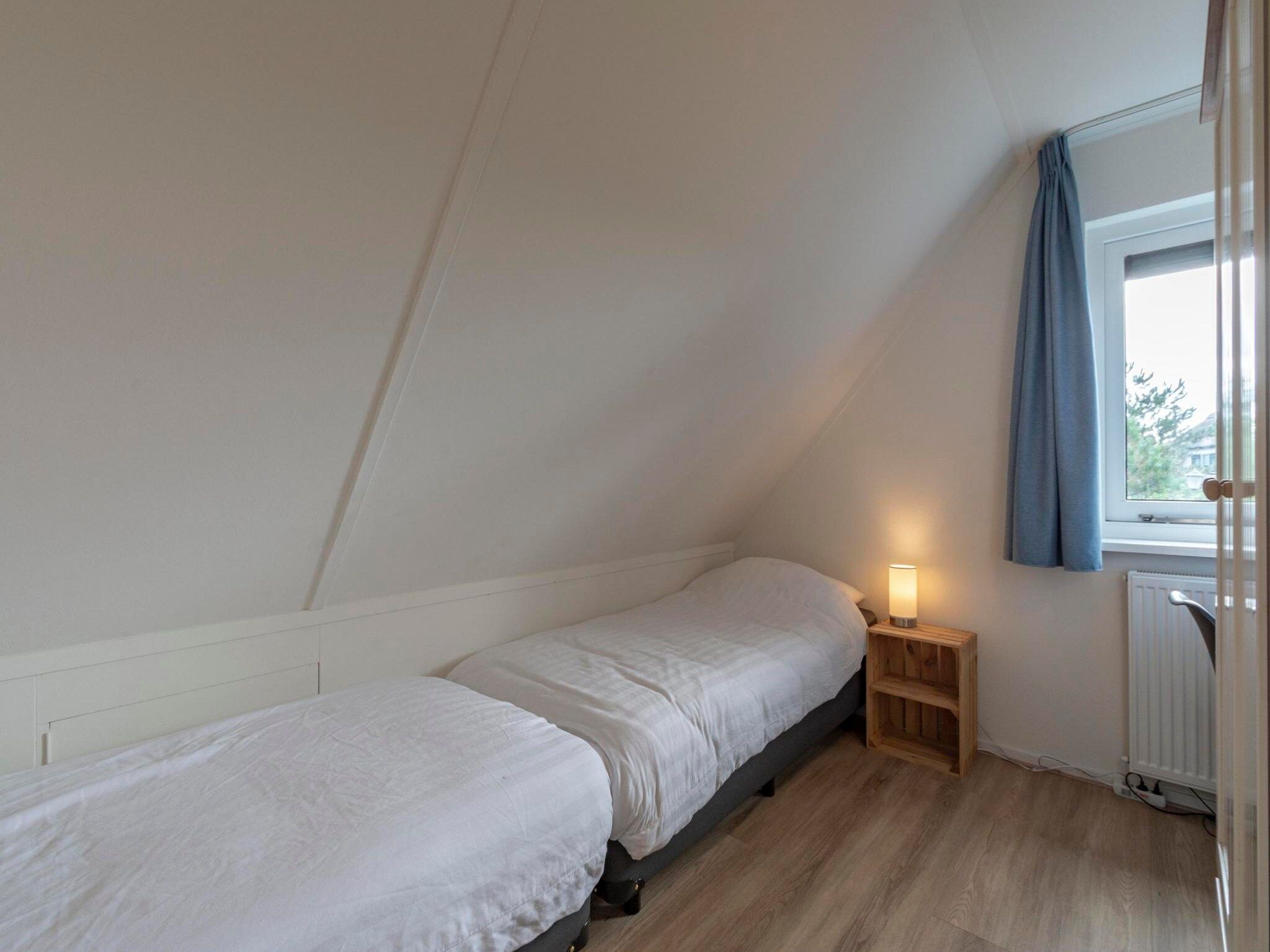 Een slaapkamer van Duynopgangh 16 in Julianadorp aan Zee