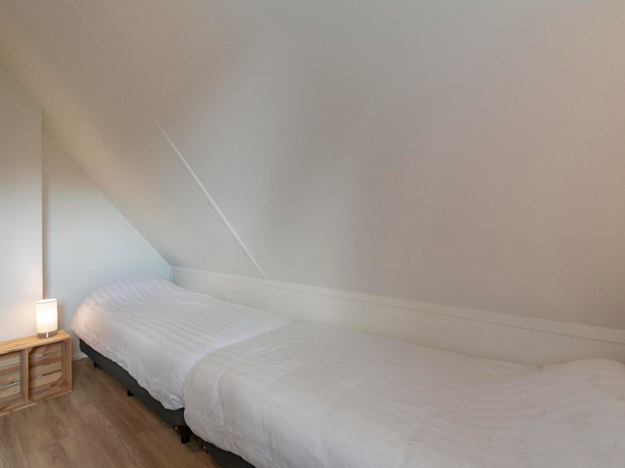 Een slaapkamer van Duynopgangh 16 in Julianadorp aan Zee