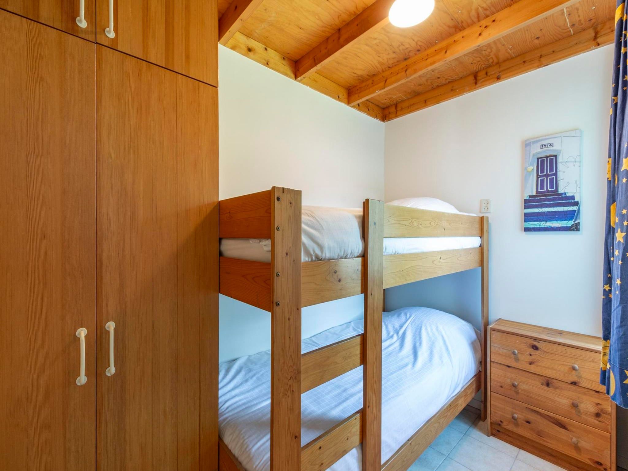 Een slaapkamer van De Blenck 54 in Callantsoog