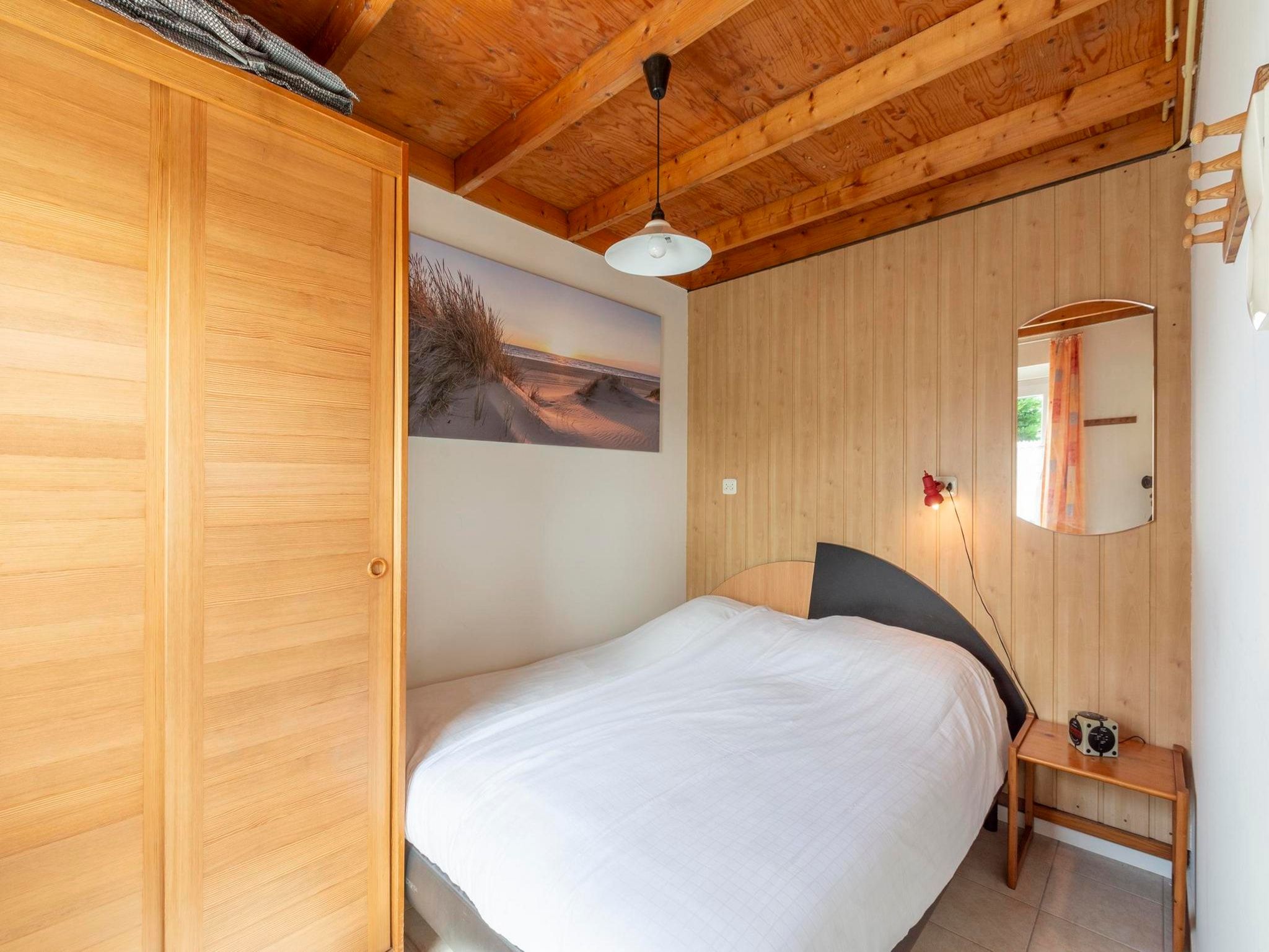 Een slaapkamer van De Blenck 54 in Callantsoog