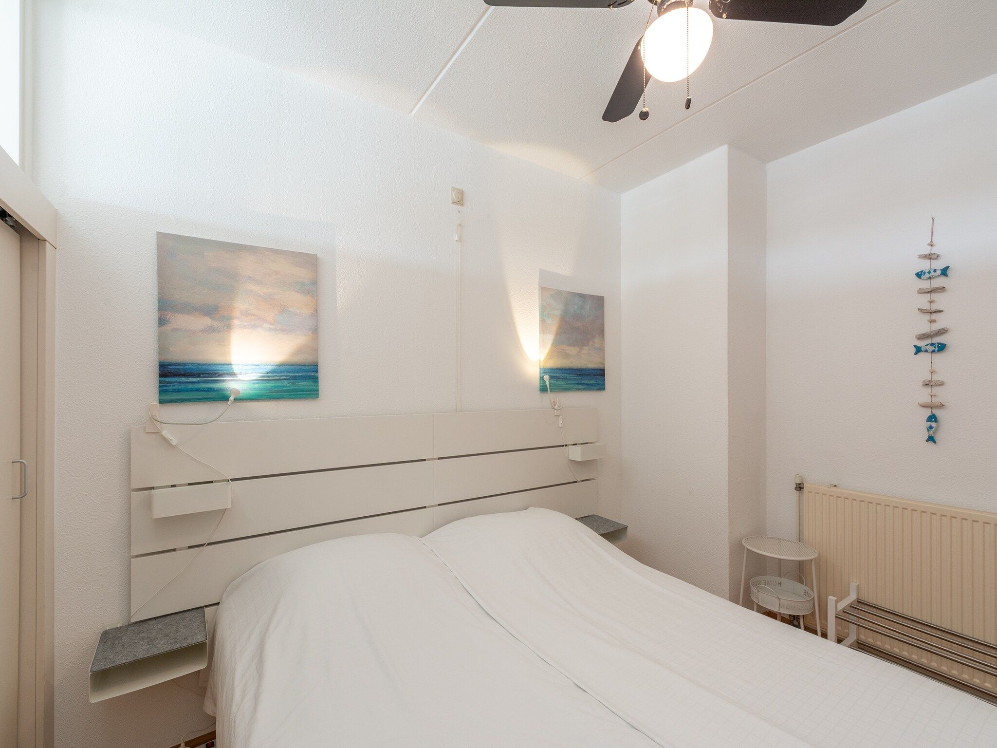 Een slaapkamer van Strandslag 225 in Julianadorp aan Zee