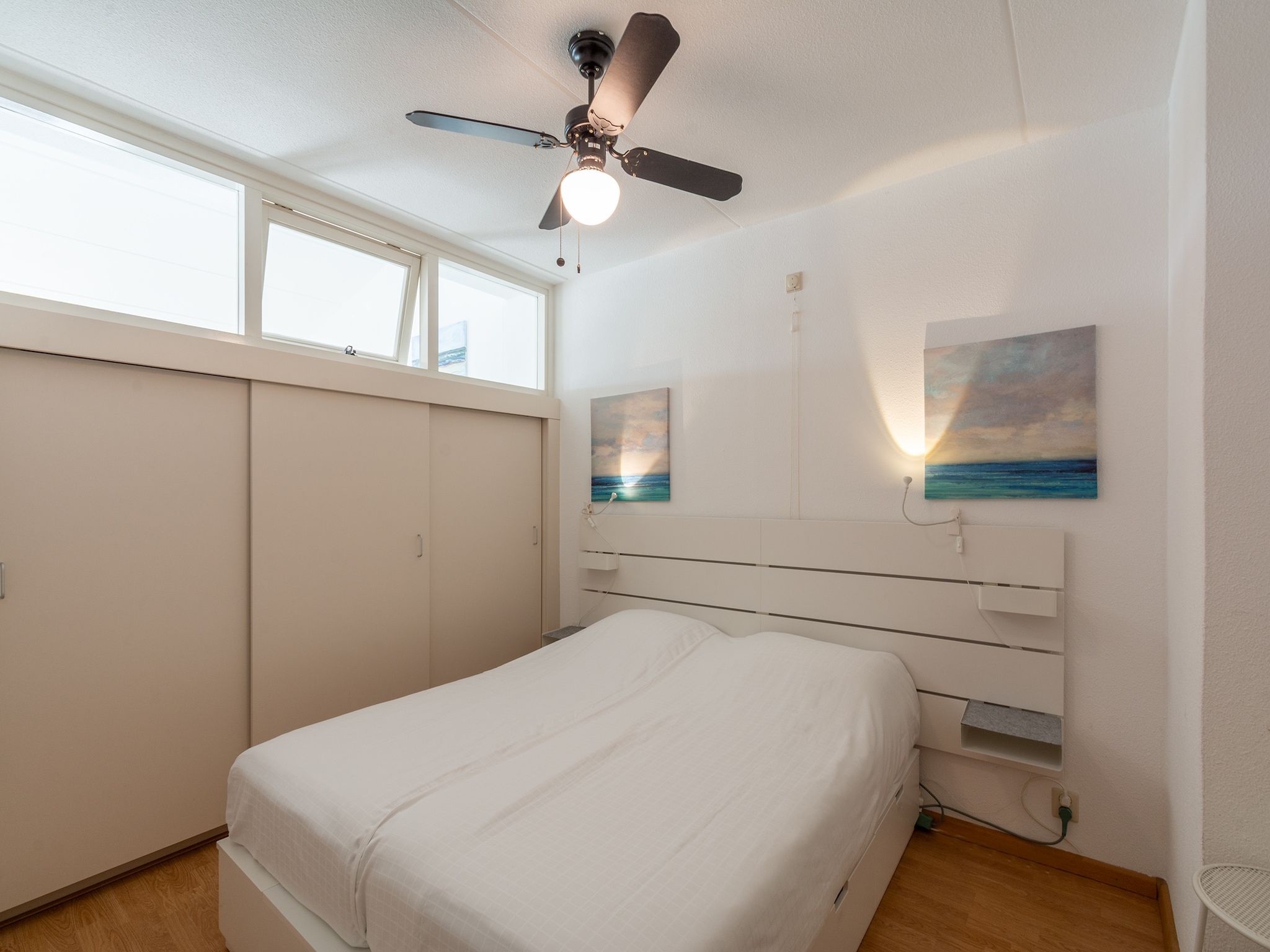 Een slaapkamer van Strandslag 225 in Julianadorp aan Zee