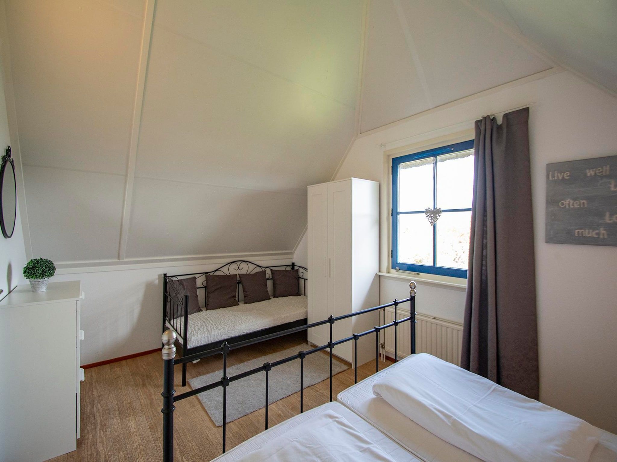 Een slaapkamer van De Buitenplaats 100 in Callantsoog