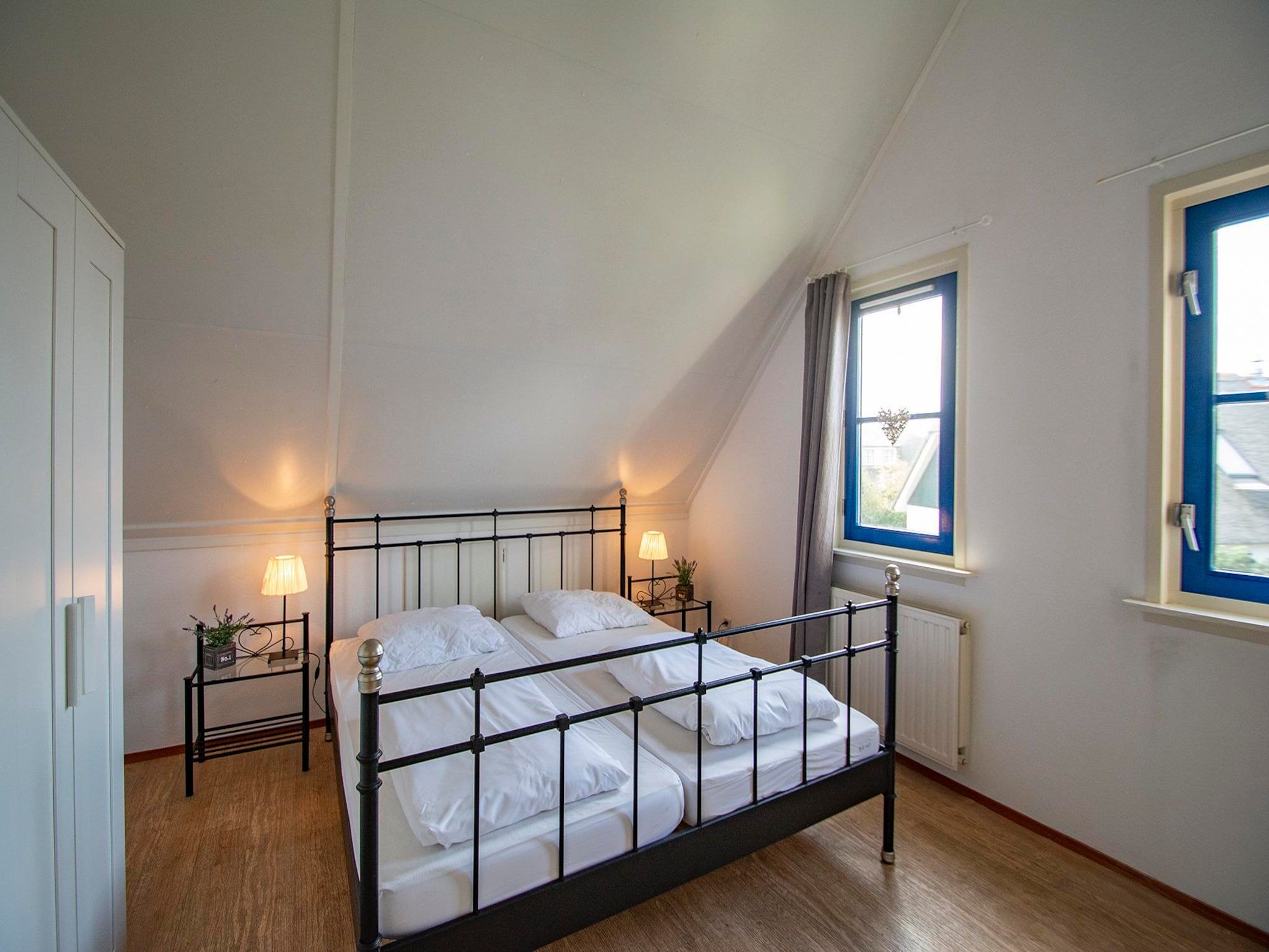 Een slaapkamer van De Buitenplaats 100 in Callantsoog