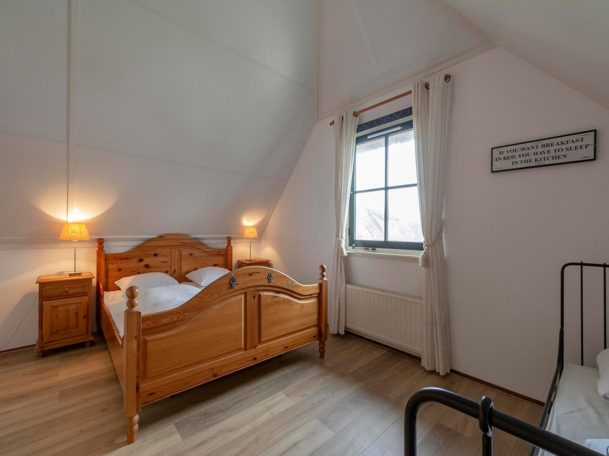 Een slaapkamer van De Buitenplaats 138 in Callantsoog