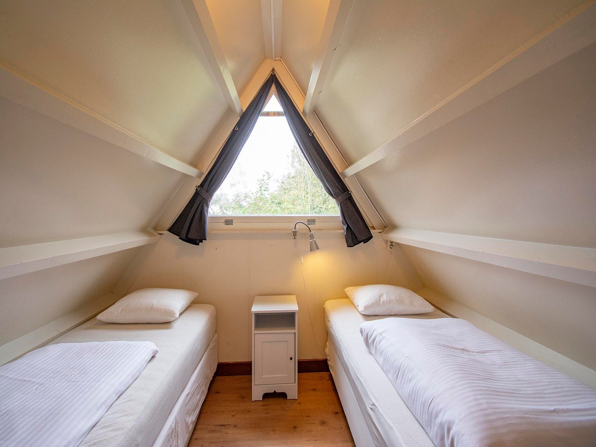 Een slaapkamer van Sandepark 151 Villa Matisse in Callantsoog