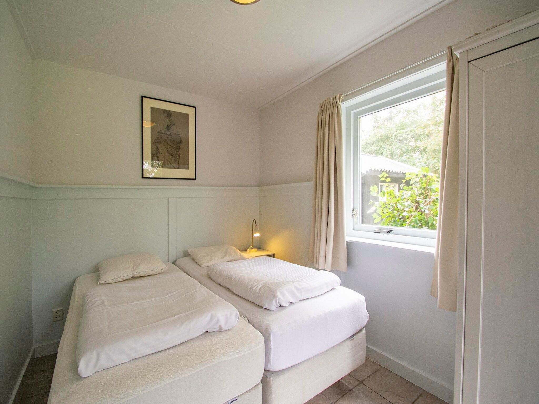 Een slaapkamer van Sandepark 151 Villa Matisse in Callantsoog