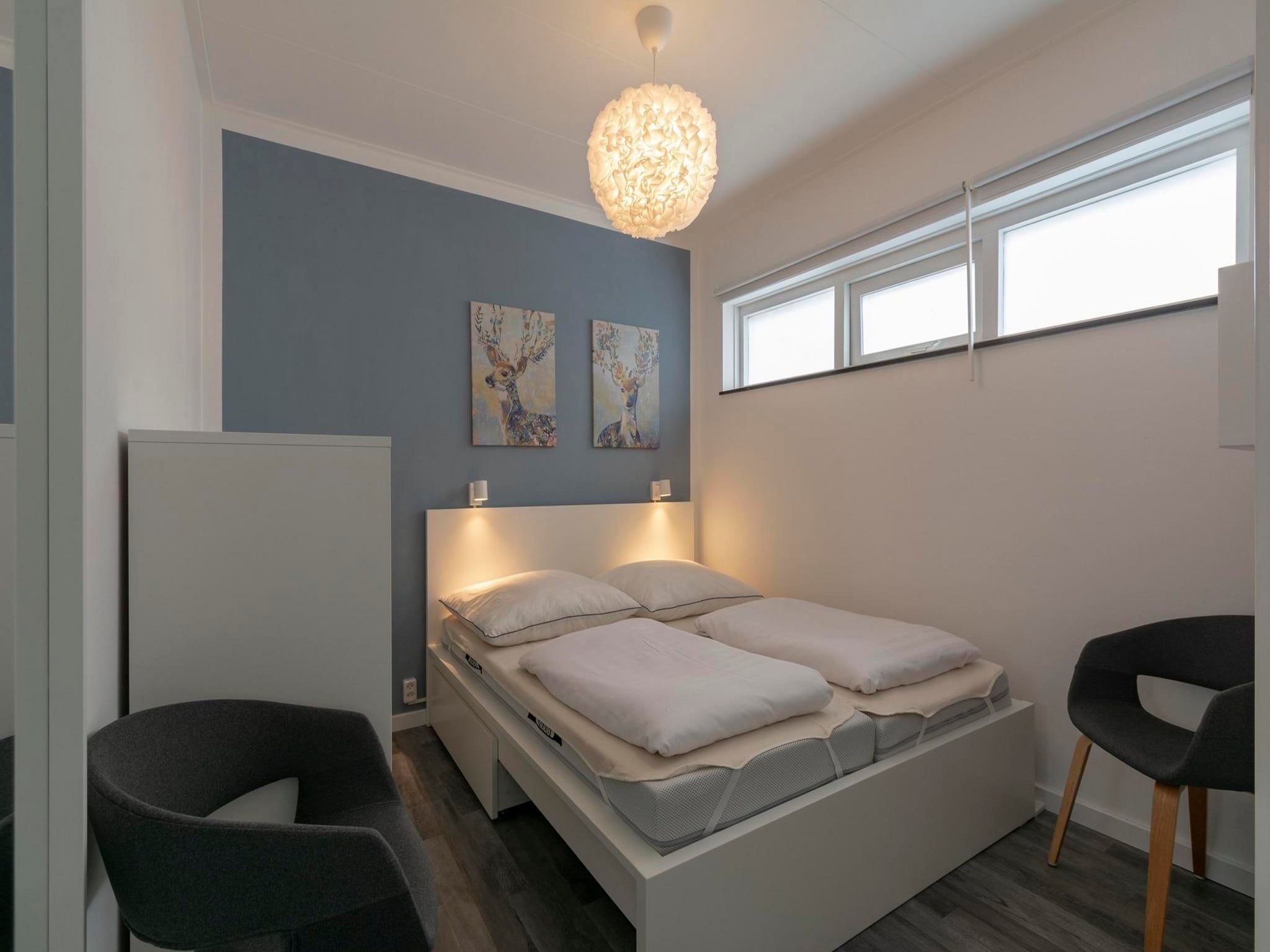 Een slaapkamer van Stuijvezandeweg 7-Z in Callantsoog
