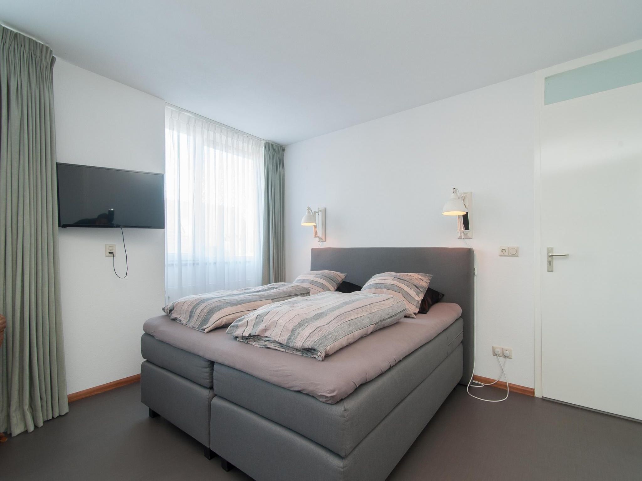 Een slaapkamer van Suite Duinzicht in Callantsoog