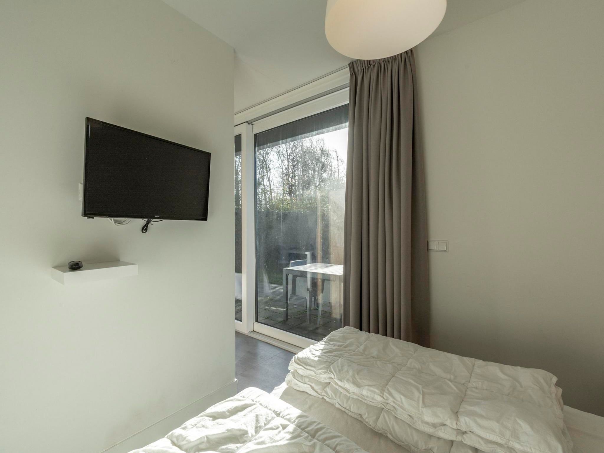 Een slaapkamer van Suite Uitwaayer in Sint Maartensvlotbrug