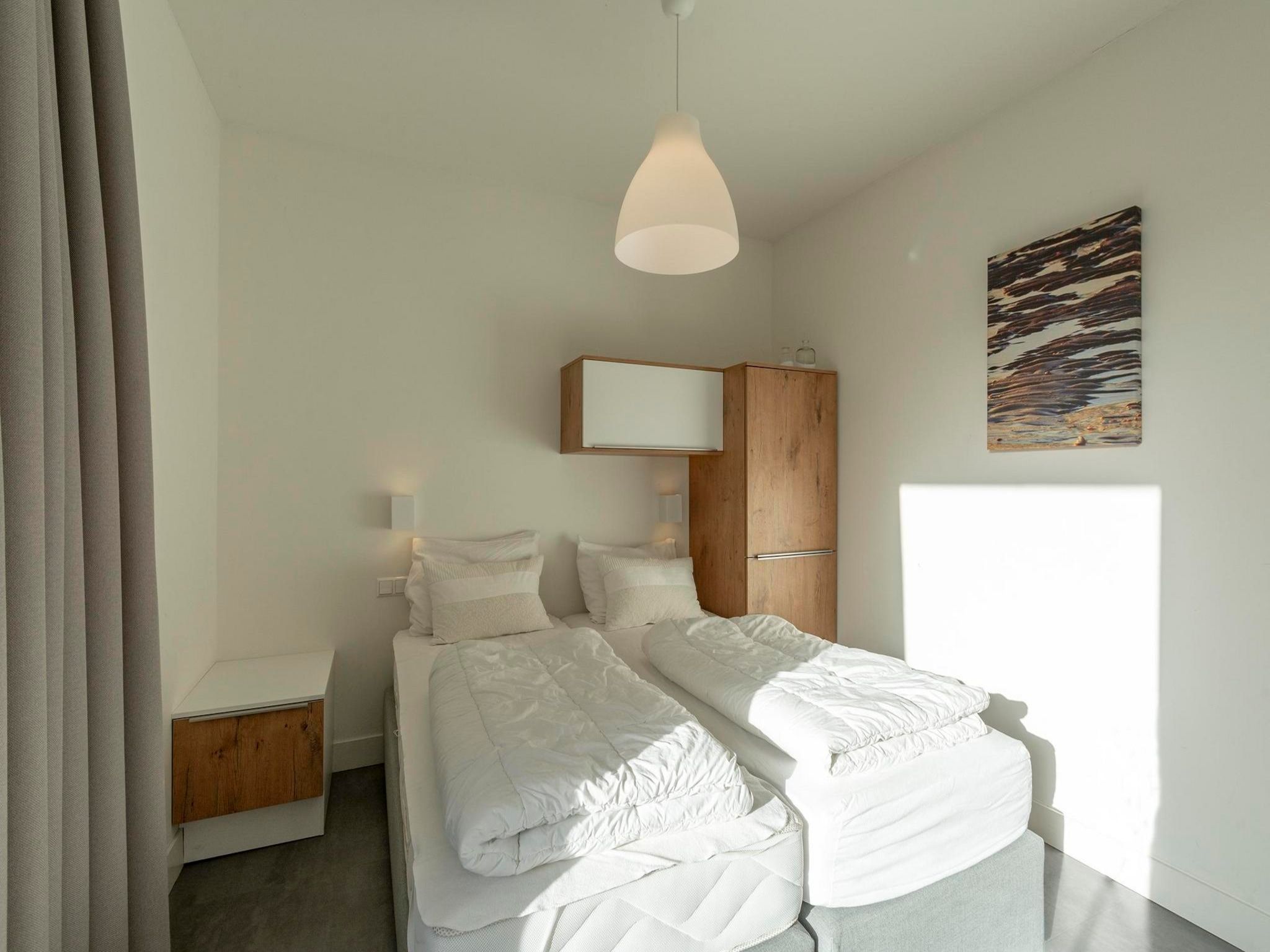 Een slaapkamer van Suite Uitwaayer in Sint Maartensvlotbrug