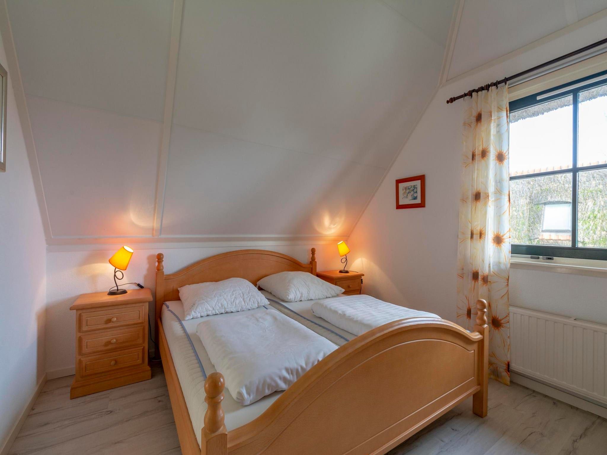 Een slaapkamer van De Buitenplaats 145 in Callantsoog