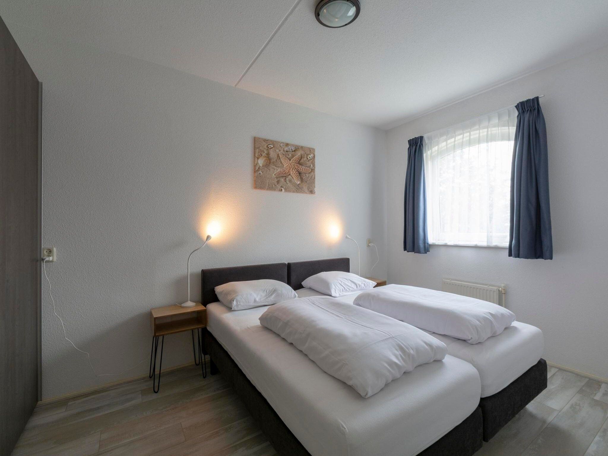 Een slaapkamer van Résidence Juliana 58 in Julianadorp aan Zee