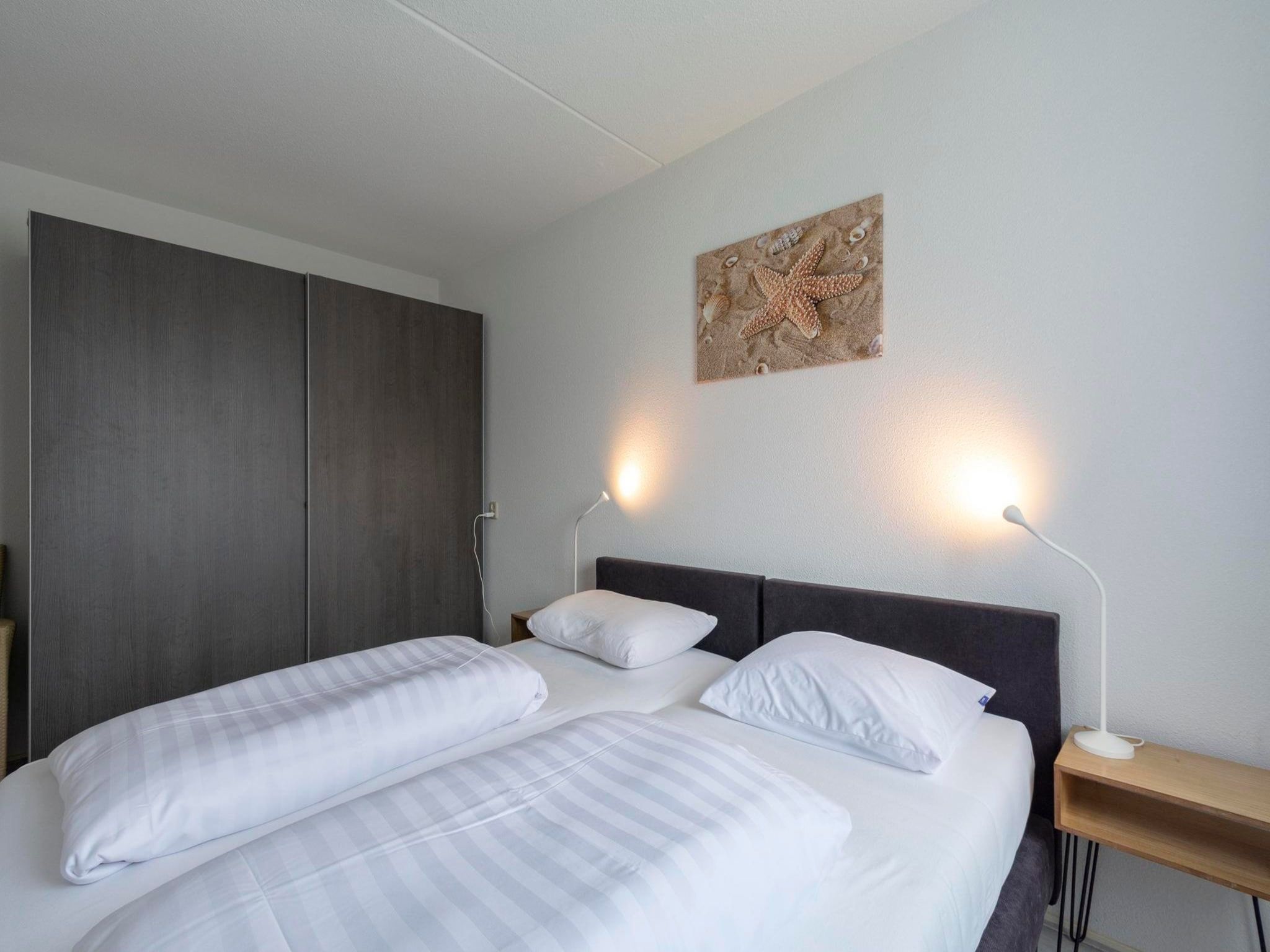 Een slaapkamer van Résidence Juliana 58 in Julianadorp aan Zee