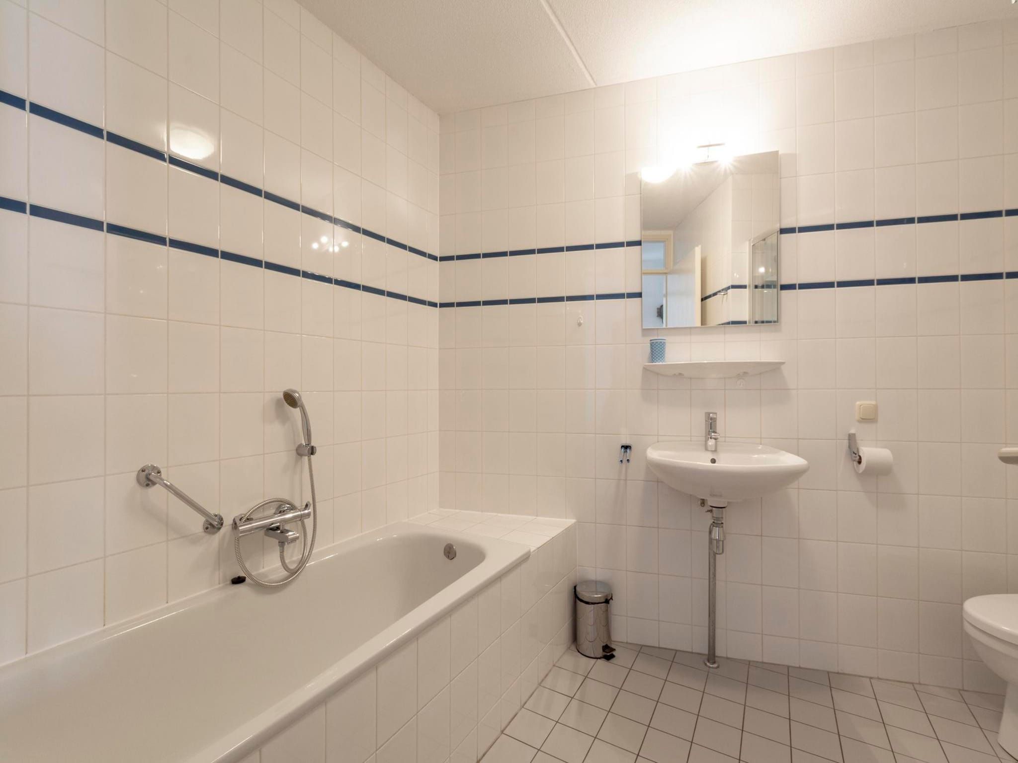 De badkamer van Résidence Juliana 58 in Julianadorp aan Zee