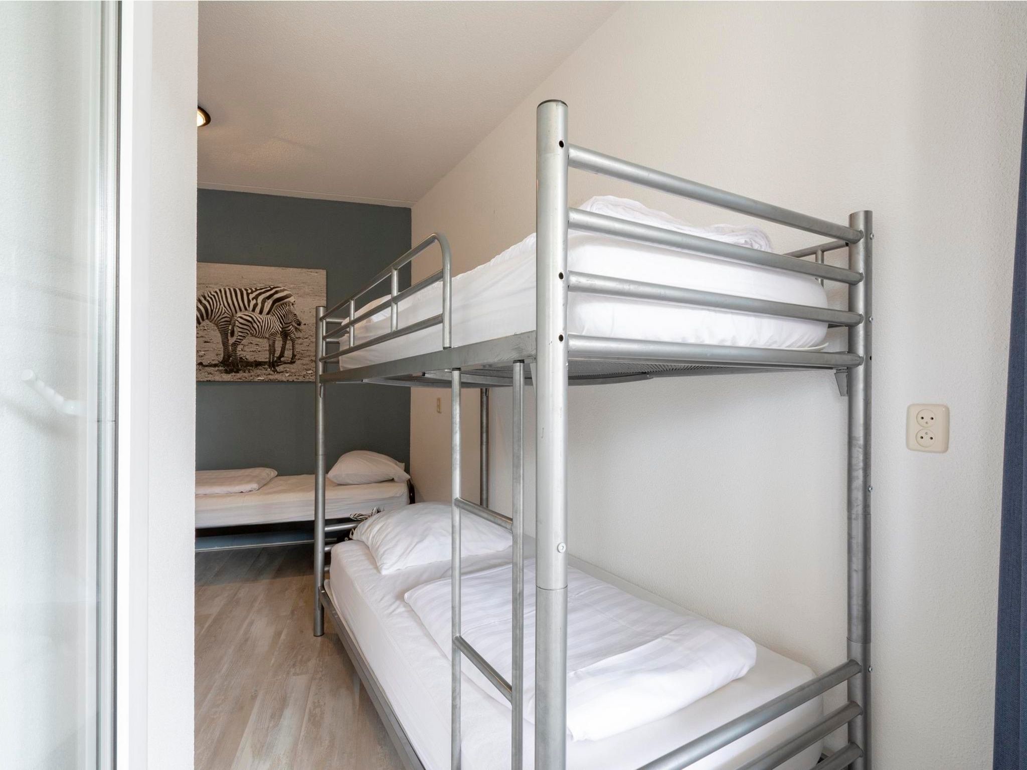 Een slaapkamer van Résidence Juliana 58 in Julianadorp aan Zee