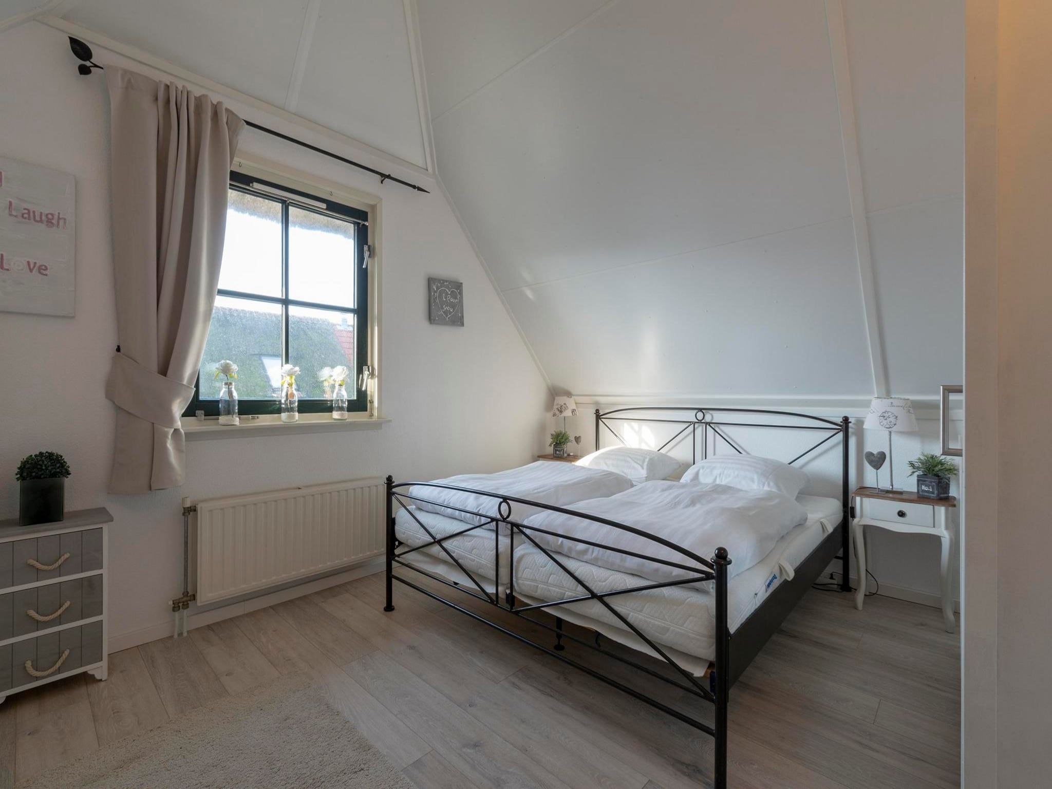 Een slaapkamer van De Buitenplaats 37 in Callantsoog