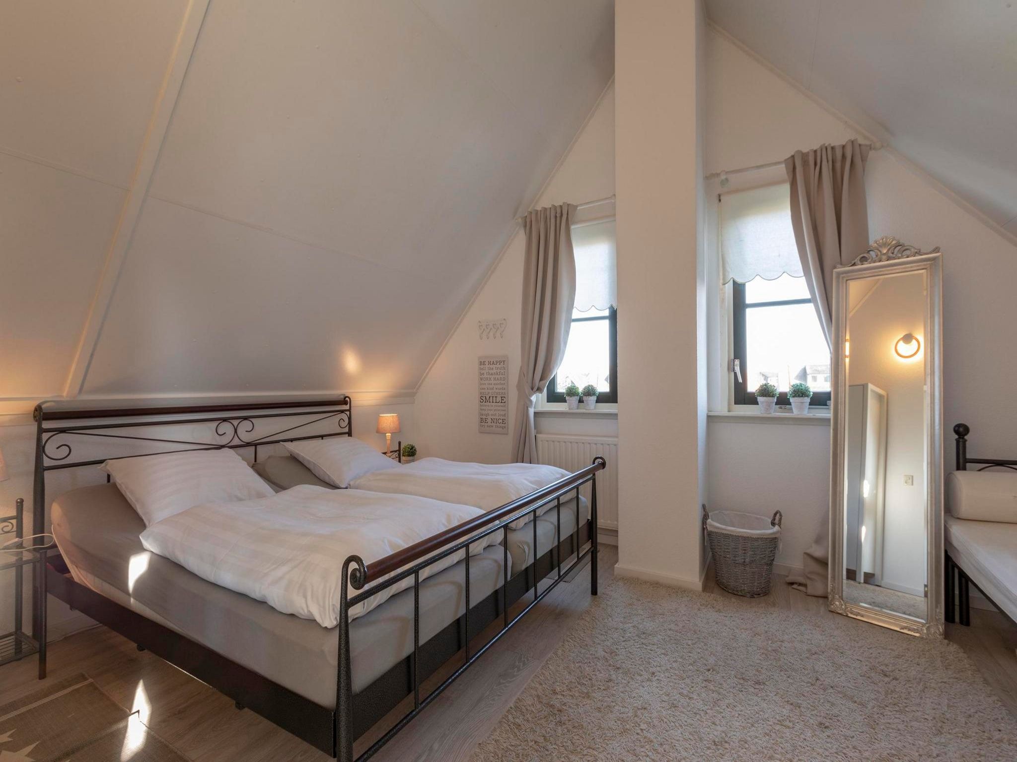 Een slaapkamer van De Buitenplaats 37 in Callantsoog
