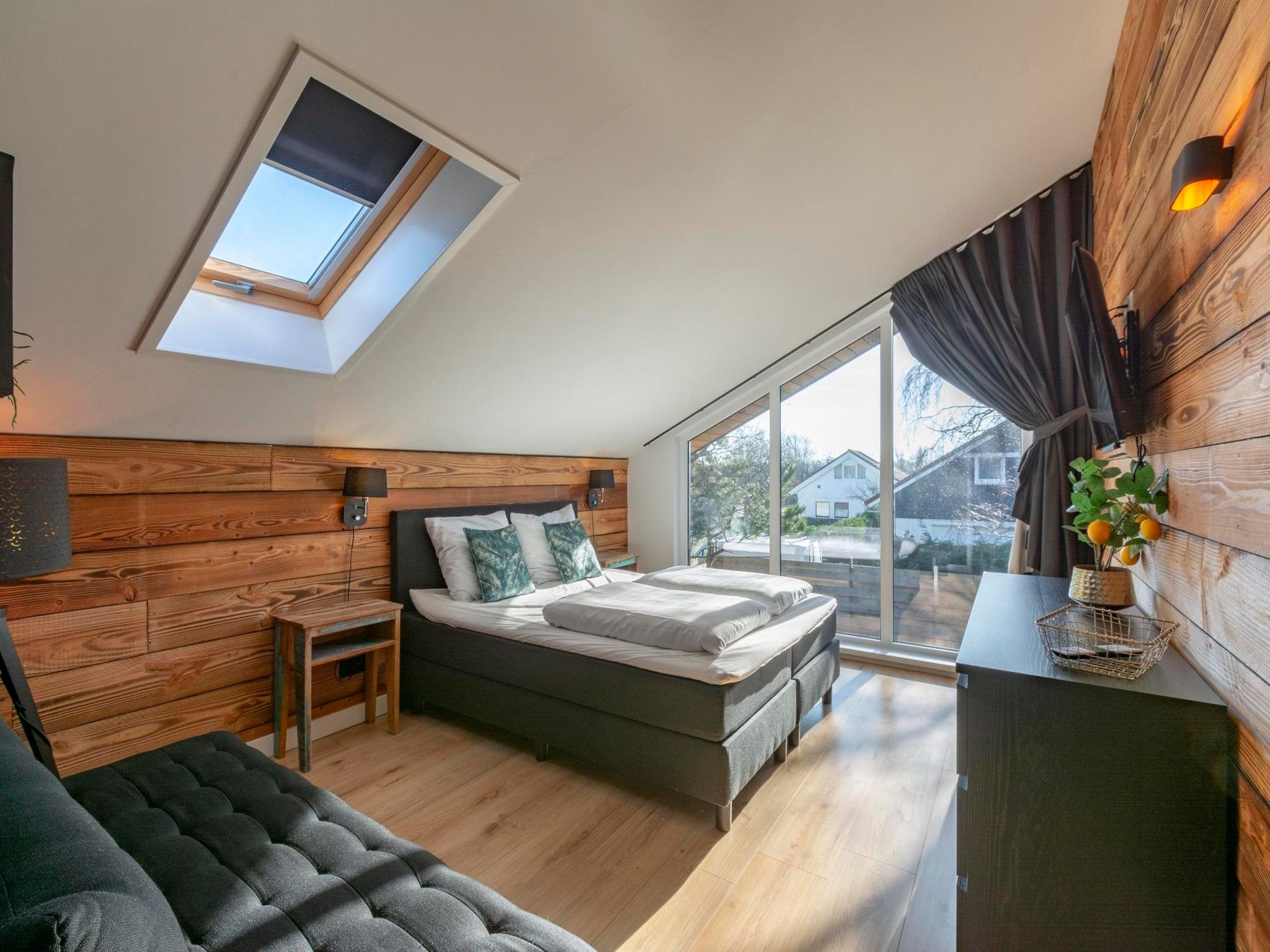 Een slaapkamer van Luxe Villa Keizerskroon - Keizerkroon 63 in Julianadorp aan Zee