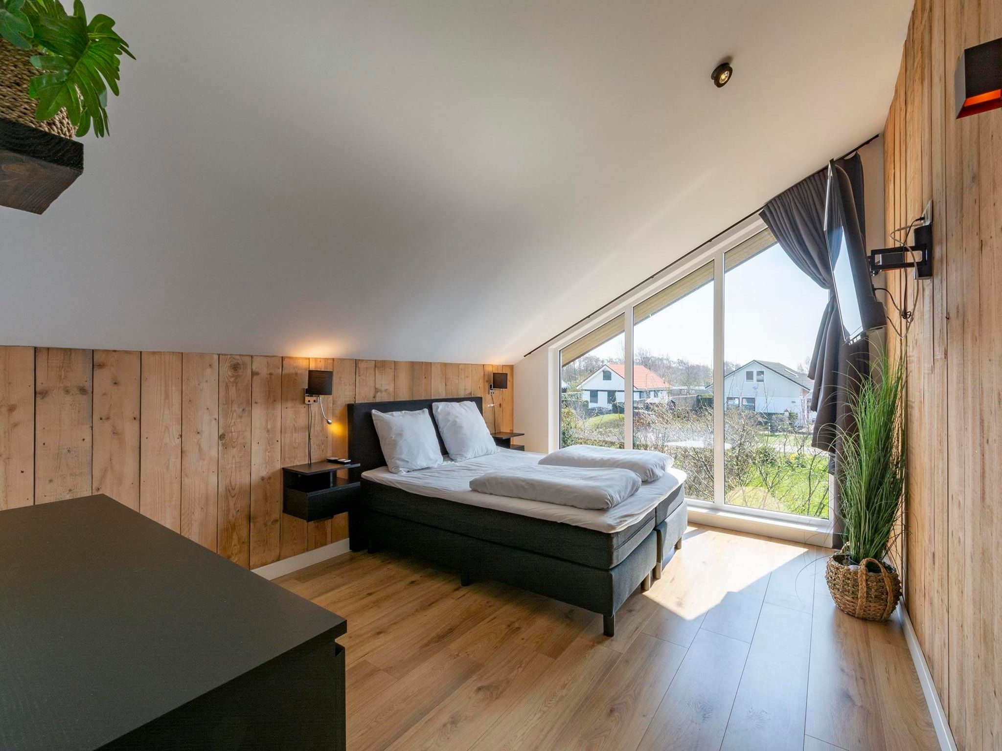 Een slaapkamer van Luxe Villa Keizerskroon - Keizerkroon 63 in Julianadorp aan Zee